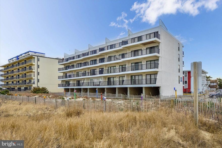 Wake up to breathtaking sunrises over the Atlantic from this stunning 2-bedroom, 2-bath luxury condo, completely reimagined from top to bottom. Set within a boutique, family-friendly garden building Sails Condos, this residence combines timeless design with modern coastal sophistication.
Every detail has been carefully curated — from the elegant crown molding and recessed lighting to the designer flooring and custom finishes throughout. The gourmet kitchen is a chef’s delight, featuring granite countertops, stainless steel appliances, and stylish cabinetry that opens seamlessly to the spacious living area. Walls of glass frame endless ocean views, filling the home with natural light and coastal serenity.
The oceanfront primary suite offers a true retreat, complete with panoramic views, private balcony access, and a beautifully appointed en suite bath. Step outside onto your expansive private balcony and take in the soothing sounds of the waves — the perfect spot for morning coffee or evening cocktails.
Located in sought-after North Ocean City, this intimate community is designed for relaxation and convenience. Enjoy easy access to the beach, local eateries, shopping, and family activities, all within walking distance. With its refined finishes, unbeatable views, and unmatched location, this oceanfront gem delivers the ultimate in luxury beach living. Drone photos coming !