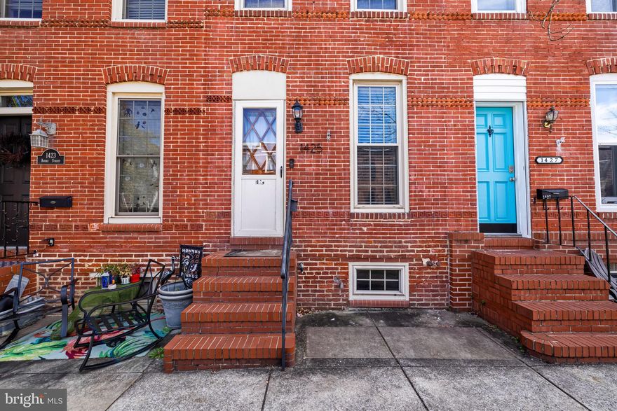 Welcome to 1425 Andre Street, located in the heart of Locust Point! This charming brick-front home offers wonderful curb appeal and a warm, light-filled living room as you enter. The centrally positioned staircase makes it easy to design your living area around sectional furniture and an open flow. Beyond the living room, you’ll find a dedicated dining area and a well-organized kitchen with plenty of counter space. The fully fenced rear yard is perfect for pet owners or anyone who loves a bit of outdoor space. Upstairs features a front bedroom, a walk-through second room, and a rear full bath. The basement provides ample storage and laundry. This home offers great potential for a new owner to make it their own. Sold As-Is.