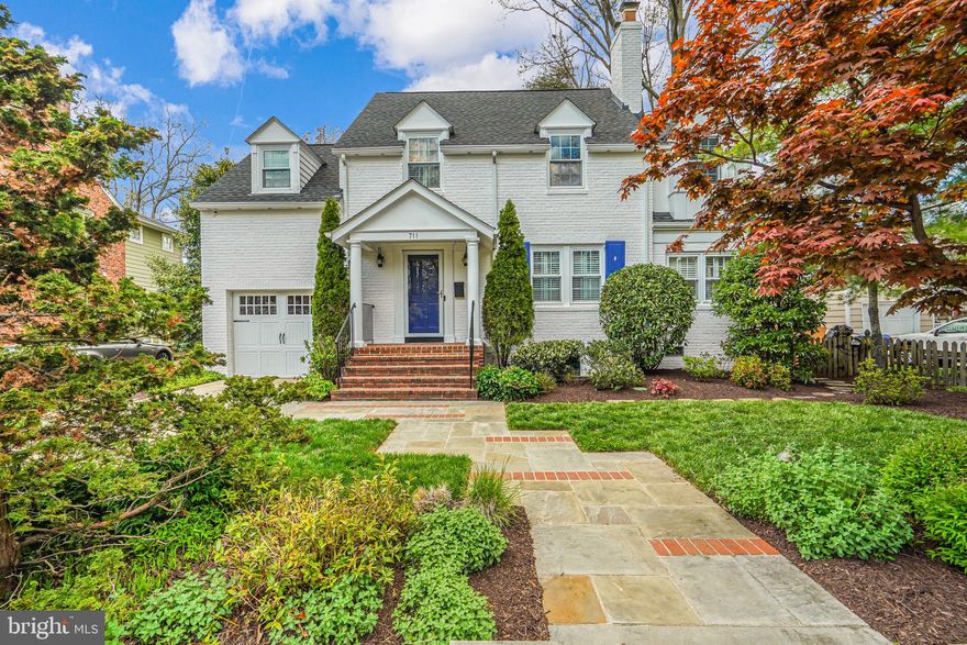 Welcome to this stately, beautiful Alexandria colonial! Situated on a quiet street in the Rosemont neighborhood, this spectacular 4 bedroom, 3.5 bathroom home offers thoughtful, contemporary upgrades inside, and a low-maintenance, spacious yard. Step inside to the original 1940s formal living and dining rooms, lined with elegant crown molding and the first of two wood-burning fireplaces that warm the space. An at home office or a cozy playroom sit just off the dining room. The entire back of the home opens into an exquisite, open concept eat in kitchen and family room with vaulted ceilings, accented with skylights and a curved wall of windows, facing an expansive backyard for the entire family to enjoy. The sun soaked, upgraded kitchen boasts 42" custom cabinetry, a granite-topped center island with gas cooktop, and stainless-steel appliances that cannot be missed! The amazing family room features the second wood burning fireplace bringing a warm and cozy feeling to a bright, large, and airy room. This family room is a stunner. The breakfast area features French doors that open to the back patio, overlooking the low-maintenance, turf play area with conveying playhouse. The playhouse has been updated and reinforced for safety, so rest assured all little ones can run around and play in the sandbox while you relax on the surrounding Flagstone patio. When you come home, drive in and park your car in the one car garage, a rare luxury for homes in Rosemont. The paved driveway and excess street parking allow for guests to easily visit. Look beyond the stunning decor and turnkey aspects of this home to find the closets all have been thoughtfully redone to maximize storage, and the attic has been enhanced with additional storage and functionality. The neighborly spirit is thriving in the community including multiple neighborhood gatherings and celebrations! 711 Fontaine is just minutes away from Del Ray, Old Town, Arlington and DC. A 10 minute walk to MacArthur Elementary or GW Middle Schools, and just a stone's throw away from the St. Stephens & St. Agnes Lower school and George Mason playgrounds.
