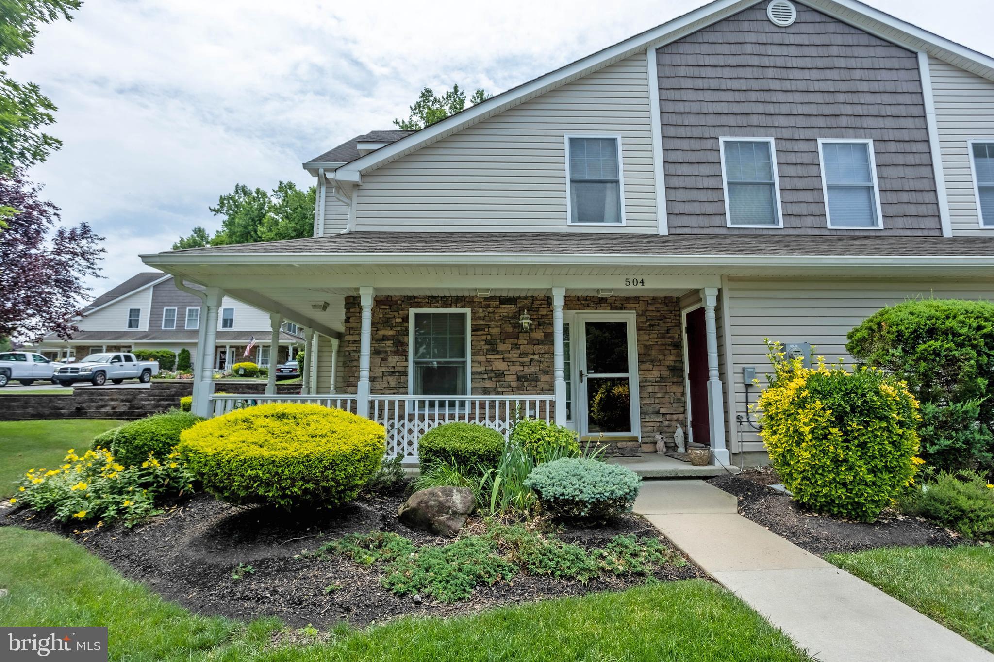 Don't wait! The Villages at Pine Valley are calling and the living is easy on Easy Street!
This clean and bright Dogwood model town home in the upscale 55+ community of The Villages at Pine Valley is being offered by the original owner. This home has all the conveniences of city living in a lovely, suburban setting! On the first floor, the living room with tile foyer features a gas fireplace for those chilly nights, custom window shades w/remote control and a soaring 20ft. high ceiling with custom ceiling fan open to the 2nd. floor loft . There is also a large bedroom featuring a tray ceiling, lighted ceiling fan, large windows with a garden view, 2 large closets and a full ensuite bath, dining area, laundry w/stacked washer and dryer and a large kitchen with solid wood cabinets, laminate flooring, gas cooking, dishwasher, garbage disposal, S/S sink, recessed lighting and tray ceiling. The 2nd floor offers a loft style sitting area (perfect for an office or whatever your imagination creates!) as well as another large bedroom with lighted ceiling fan, large walk in closet w/custom shelving and full ensuite bath. The wrap around porch is perfect for relaxing with friends and family. There is 200 AMP service, heated outside storage room and fresh paint throughout. There are 2 designated parking spaces right outside your door. HOA fees cover all outside maintenance for the unit and all common areas including snow removal, landscaping and painting. The fees also provide access to the community clubhouse with use of the fitness center, banquet room, indoor pool and so much more! One year home warranty included. C'mon! Haven't you always wanted to live on Easy Street?