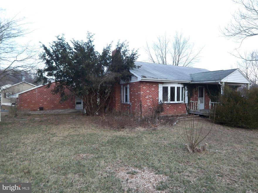 Brick Rancher in As-is Condition on Martinsburg Road close to Hedgesville and I-81. 3 bedroms, 1 bathroom, eat in kitchen, living room with wood stove and a full unfinished basement. Large detached 2 car garage.