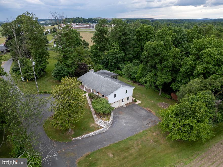 Single-level living at its finest with new upscale renovation showcased on a private cul-de-sac lane with a lofty vista and backdrop of wooded privacy, nestled in farmland protected by clean & green. The best of both worlds, a private country setting with the Morgan Crossings Walmart Super Center just 1.3 mi away.  The 1.15 acres of lawn care (mowing) is included in the rent, and the tenant is only responsible for weeding the mulched/pebbled areas and miscellaneous weeds. This spectacular location offers quick access to major roadways including Rt.23, Rt.82, Rt.401, Rt.10 & PATP. The highly acclaimed Twin Valley Elementary, Middle, and High Schools are within eyesight, while the Elverson Urgent Care, Firehouse, Morgantown Casino, and parks are just moments away. The setting offers paved parking just outside the main level entrance and additional paved parking for the walk-out basement and garage. No expense spared, a recent six-figure renovation includes an expansive gourmet kitchen with gorgeous NEW granite, NEW farmhouse sink, NEW cabinets – lots of drawers, NEW backsplash, NEW lighting, NEW LG stainless suite of appliances, including the refrigerator. The NEW super thick Commercial Grade Luxury Vinyl Plank flooring throughout the open floorplan offers a solid luxurious feel. A new sliding glass door leads to a 25x14’ three-season room with a NEW ceiling fan and outside access. No smoking inside, however, smoking is permitted in the 3-season room. Every room has a new ceiling fan and lighting, plus nice details including automatic foyer lighting and a coded door knob... The owner suite has a full bathroom with a NEW oversized shower, NEW Commode, NEW vanity with a NEW granite top, and gorgeous NEW stone tile flooring. The hall bath is also upgraded with a NEW Commode, NEW vanity, NEW granite top, NEW tub/shower, and NEW front load LG Washer & Dryer on the main level. The basement renovation is almost complete, and the tenant will have full use of the basement when complete. The basement family room, full bathroom, and office will be floored with the same gorgeous stone tile used in the main-level bathrooms. The 27x11’ basement storage and utility room will remain unfinished. The 22x15’ garage is available for the tenant to use now. The 27x13’ basement family room will be outfitted with new recessed LED lighting, and has a daylight walk-out and a fireplace, the fireplace is decorative and cannot be used for woodburning. The full bathroom in the basement will be completed with a NEW shower,  NEW commode, and NEW sink. The 21x12’ basement office with daylight walkout and full-sized windows is shown in the photos section and has new insulation & drywall, and will have lots of recessed LED lighting and a ceiling fan. Even the home's efficiency has been improved for comfort and lower energy costs, including a new front door, new sliding glass door, new basement doors, new windows, and new siding on the sides and back with additional insulation ( the tan siding on the front is now white), new spray foam insulation in the attic area, NEW heat pump with all new ductwork, and two NEW mini-split heat pumps have been installed for the basement area offering a total of 3 HVAC zones. Even the 80-gallon water heater is an energy-efficient hybrid heat pump system that offers the bonus of helping to dehumidify the basement. Service Electric Cable and Windstream DSL are available. The tenant pays for electricity. If desired, the tenant pays for: Cable; DSL; Phone Land Line. The tenant is responsible for clearing snow from their vehicles, parking area, and walkways. Up to 4 pets are permitted (cats & dogs). A non-refundable deposit of $250.00 per pet is required, plus a photo and name of the pet. The dog(s) must be friendly.