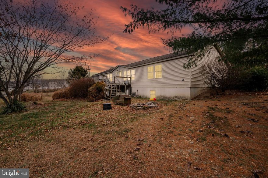 AGENTS - PLEASE VIEW AGENT REMARKS IN BRIGHT MLS. This unrestricted 2100 sq ft 2002 Foremost split bedroom home on a full Superior Wall basement on 1.6 unrestricted acres will not last long! The kitchen is outfitted with tons of cabinets, crown molding, a center island with pendent lights, plenty of recessed lights and pass throughs to the family and living rooms. The family room has a vaulted ceiling and a large built-in entertainment center. The primary bedroom has a vaulted ceiling and large walk-in closet with a built-in corner unit.  Primary bathroom has dual sinks, garden tub with jets, and skylight. All of the bedrooms have built-in cabinets and walk-in closets. The 18x13 deck. Heat pump is 5 years old. The unfinished basement has 9ft ceilings, interior stairs, a 1 car garage door and utilizes the superior wall system. Minutes to Spring Mills and Martinsburg with easy access to I81, shopping and restaurants. Sold AS-IS.

Please schedule all showings online via Showing Time.

Offers may be entered ONLINE through Friday, December 26, 2025 at 3:00 pm.

AT SELLER'S DISCRETION, AN OFFER MAY BE ACCEPTED AT ANY