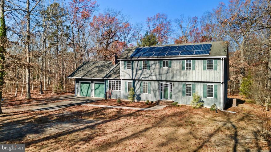 This thoughtfully designed two-story home is nestled in a tranquil, private setting, offering a perfect blend of comfort and functionality.  The spacious layout includes a large, well-appointed kitchen with a center island, ideal for both cooking and family gatherings.  The living room and family room are both ample in size and allow for easy entertaining.  A bright and airy three-season room provides a peaceful retreat, while the oversized garage offers ample space for vehicles and storage.  The full, unfinished basement presents endless potential for customization or additional living space.  The enormous primary suite and bathroom with jacuzzi tub are standout features, offering room for relaxation and the possibility of conversion into an additional bedroom if desired as it was framed to allow for a fourth.  On the main level, a versatile bonus room/office with access to a full bathroom provides the potential for a first floor primary suite, making this home a great choice for a variety of living arrangements.  Additional outstanding features include a wood burning fireplace, large dining room, the convenience of an upstairs laundry in close proximity to the bedrooms and a nice size rear deck.  This property combines practical and efficient design with six inch exterior walls, one inch foam wrap and solar panels.  With all these great features and its serene surroundings, this is the perfect place to call home.