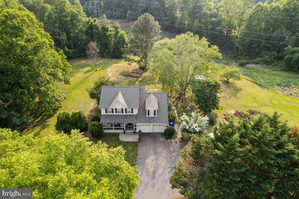 A well-cared-for property with 3 flat, usable acres in Hughesville. This 4-bedroom, 2.5-bath Colonial has been updated over the years and offers a rare mix of space, function, and freedom with no HOA and land that’s been used for horses before.
The interior is clean and move-in ready, with new wide-plank vinyl flooring, updated bathrooms, and custom finishes like iron stair railings and upgraded lighting. The main level includes a traditional living room, formal dining room, and a large family room with cathedral ceilings and a propane fireplace. The kitchen has stainless steel appliances, solid cabinet storage, and direct access to the back deck.
Upstairs includes the primary bedroom with its own full bath and three more bedrooms - including a large bonus room that works well as a guest suite, office, or fourth bedroom. The walk-out basement is unfinished but dry, with rough-in plumbing already in place for another bathroom.
Outside, the land is open and fully usable. A hydrant is installed at the back of the property for easy access to water animals or garden beds. There’s a shed, room to fence in pasture, and plenty of parking. Whether you want animals, space to grow food, or just some breathing room, this property is set up for it.
Eligible for USDA financing and the Maryland Mortgage Program (MMP), which offers potential down payment assistance.
For loan and MMP questions, reach out to Natalie Miller or Gary Pierpont at First Home Mortgage.