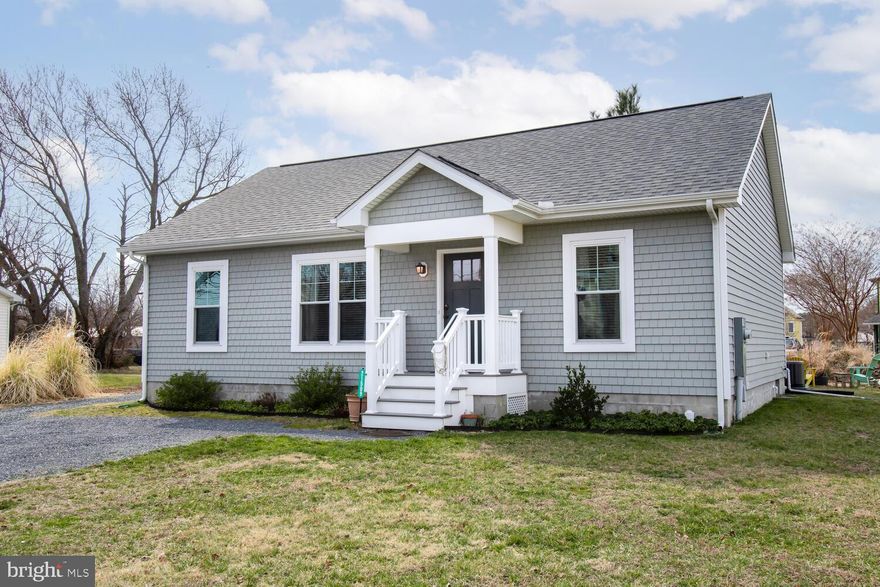 Nestled in the heart of Tilghman Island, this charming cottage was built in 2020.  The home features an abundance of natural light creating an inviting atmosphere throughout the open floor plan of this home.  The kitchen features tile floors, granite counters, and a stylish island with bar seating. Laminate wood floors flow seamlessly through the living room and bedrooms. The split floor plan ensures privacy with the primary suite on one side, offering a double vanity sink, shower, and a spacious walk-in closet. On the opposite side of the home, two additional bedrooms and a full bath. Enjoy the outdoors on the large screen porch, perfect for crab feasts, or gather around the firepit area.  A separate shed is perfect for storage of your outdoor hobbies or lawn equipment.  With proximity to restaurants, numerous boat landings, prime fishing spots and the perfect central location for boating to St. Michaels, Kent Island, Oxford, Cambridge and Annapolis this home offers a perfect blend of comfort and coastal living.