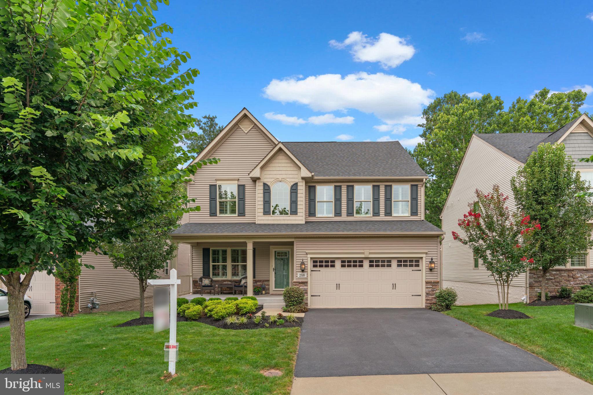 Welcome to 2518 River Ridge Trail. Step into modern elegance with this beautiful three-level home nestled on a gorgeous homesite backing to trees in Howard County’s popular community of The Estates at Patapsco Park. Embodying livable luxury, the residence showcases sophisticated architectural elements, gleaming hardwood Maple floors, detailed trimwork and mouldings, vaulted and tray ceilings, a refined natural color palette, and generous windows bathing the space in natural light.
A charming front porch opens to the impressive interior presenting 3,415 finished square feet with a perfect blend of formal and casual spaces including an inviting foyer, a formal dining room, a study, and a cozy living room with a stacked stone gas fireplace, light-filling windows, and an open concept flow to the kitchen. Designed for both style and function, this stunning kitchen is an entertainer’s dream equipped with stainless steel appliances, custom Italian marble backsplash, white cabinetry with ambient underlighting, recessed lighting paired with a statement light fixture, granite counters, and an extended island that can double as a breakfast bar or table space. The adjacent sunroom or breakfast room features glittering windows overlooking the park, and a door leading out to the deck.Enjoy peaceful mornings with coffee or al fresco meals with friends on this expansive deck overlooking protected park land.A staircase leads down to the backyard complete with a covered patio and a French door accessing the finished lower level. Highlights of this level include the huge rec room, the fifth bedroom, a full bath, a bonus room used as an exercise room, and an unfinished area for storage.
Upstairs, the owner’s suite is a relaxing retreat enhanced with a stunning tray ceiling, two walk-in closets, and a private bath with a dual sink vanity, a frameless glass shower with built-in seat, a soaking tub, and a water closet. Also on this level you’ll find convenient bedroom-level laundry, a full bathroom with a dual sink vanity, and three additional bedrooms—all with soft neutral colors, Plantation shutters, and breezy ceiling fans.
This popular and intimate community boasts an ideal setting—direct access into Patapsco State Park with hiking and biking trails, plus close proximity to shopping, dining, recreation and entertainment, commuter routes, Historic Ellicott City, downtown Columbia, and more.
Built in 2018 by Ryan Homes and proudly maintained and updated by the original owners, this amazing home is ready for you to call your own!