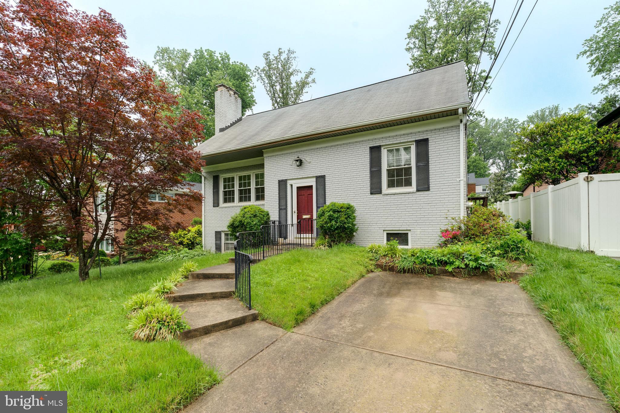 Exceptional opportunity in the heart of Greenwich Forest, just one mile to downtown Bethesda. This spacious home offers four bedrooms and two full baths on the upper level, including a generous primary suite and well-proportioned secondary bedrooms. The main level features a large living room with fireplace, a separate dining room, and an oversized kitchen that opens to a bright breakfast room. A sunroom/four-season porch provides additional flexible space, while a main-level bedroom or home office is served by a full bath.
The finished lower level includes a wide recreation room with second fireplace, dedicated laundry area, and ample storage space. Deep, private lot with mature landscaping and off-street parking. Sold in as-is condition—bring your vision and a little TLC to transform this home into something special.
