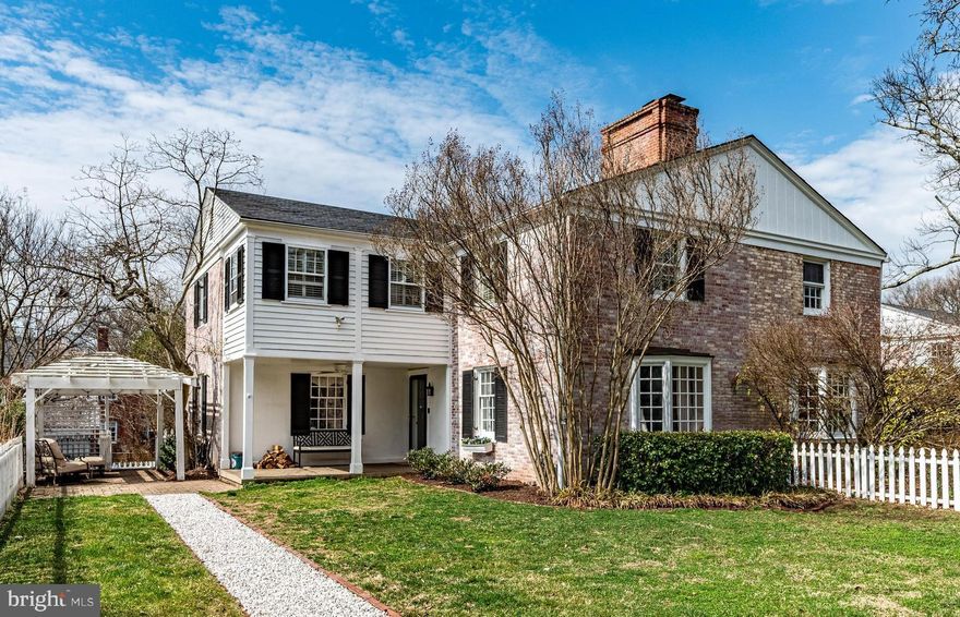 Nestled in the heart of Homeland, this Palmer & Lamdin masterpiece offers a slice of Charleston in North Baltimore. Situated on the enchanting Middleton Court, the residence is part of an exclusive enclave of just 12 homes built in 1931 to be accessed by a tranquil central footpath, ensuring a serene, car-free front vista. While the exterior preserves iconic grace with its signature side piazza and white-washed brick, the interior has been meticulously reimagined for modern living. The home features a seamless blend of historic soul and contemporary luxury, boasting marble countertops, classic subway tiling, a fresh designer color palette, and updated mechanical systems. The versatile floor plan includes three spacious bedrooms plus a dedicated sunny office and two full baths on the upper level, while the spacious and sunny finished basement provides an expansive lower-level retreat. Steps from the neighborhood’s decorative lakes and Belvedere Square, this home offers a perfect marriage of Southern architectural heritage and high-end modern convenience. Enjoy your private yard, patios and covered front porch for playing, gardening or dining al fresco. Convenience is abundant with a designated driveway and alley parking as well.