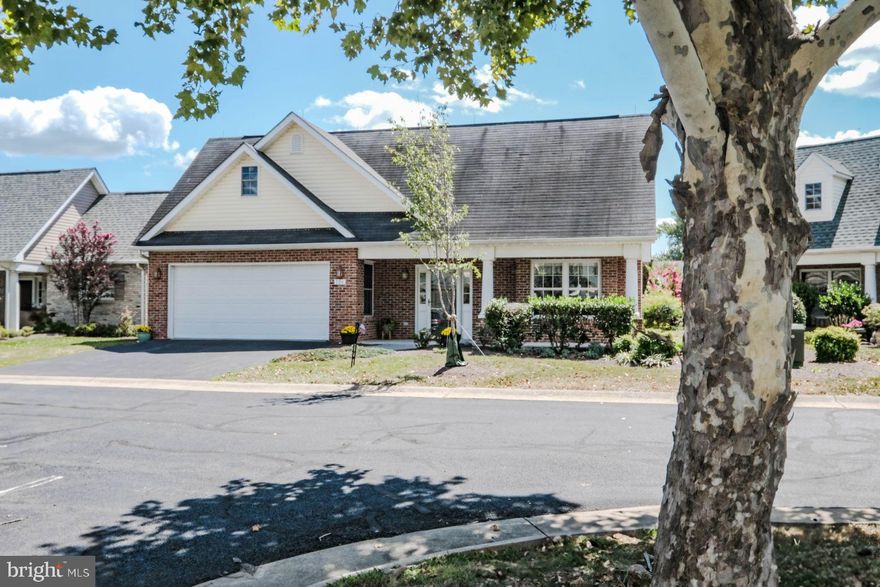Welcome Home to this Gable Front Cottage & Relax on your Front Porch.  One level living  with elegant features: crown moulding, chair railing, shadowboxing, wainscotting, french doors, 6 panel doors, display shelving & cabinetry, gas log fireplace w/hearth & mantel, plantation shutters, roller shades, roman shades, recessed lighting and laminate plank flooring.  Enjoy your Kitchen with breakfast nook alcove,  pantry w/ custom glass door, raised panel cabinets with  trim moulding, pull-out shelves & black matte pulls & knobs, a French refrigerator, gas range and stainless doube sink w/ single lever faucet.  The open-layout living & dining rooms offer beautiful space for entertaining with access to the outdoor living areas - a screened porch w/ ceiling fan and a patio surrounded by hardscape & landscaped garden.  The Owner's Suite faces the eastern sun, garden side, with ceiling fan, a private bathroom w/ seated shower & a walk in closet.  The 2nd bedroom provides another ceiling fan &  walk in closet.  Separate laundry room with newer washer & dryer.  Well maintained with new heating/AC unit and new water heater.  Located in Cross Creek Village senior community, with a clubhouse  to meet your neighbors, friends & family, with kitchen, lounge, multipurpose room and walking & bike paths. Convenient to hospital, Rock Harbor Golf, shopping, grocery, Shenandoah University for theatre or concert, several history museums, art galleries, downtown historic district & walking mall, restaurants, Green Circle Trail, Apple Blossom Mall, Winchester Country Club and adjacent to preserved battlefield park.  Commute routes I.81 & Rte 66 to Washington DC & Dulies International Airport.  Call today for a private appointment to tour this lovely home.