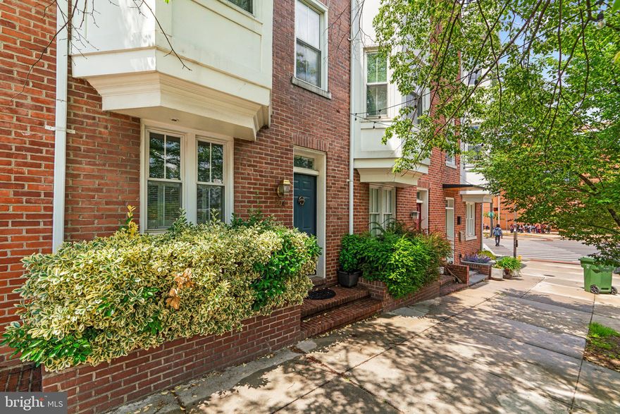 Welcome to this beautifully maintained 4-level townhome featuring incredible unobstructed Harbor water views in the heart of Federal Hill.  Gleaming hardwood floors flow throughout, beginning on the entry level with a formal dining room, a convenient half bath, and a beautifully appointed kitchen featuring glass-front cabinetry, granite countertops, a detailed tile backsplash, a center island, and access to a private, charming patio—perfect for outdoor dining or quiet relaxation.


The first upper level offers two spacious, sun-drenched rooms—one with a cozy wood stove—ideal for a family room or home office. The second upper level is home to the generous owner's suite with ample closet space and a luxurious en-suite bath with a double sink vanity.


At the top level, you'll find a skylight in the hallway along with access to a showstopping rooftop deck where breathtaking panoramic views of the Baltimore skyline await. A second bedroom, full bath, and a sunroom with a wall of windows and access to a private deck, also with stunning city views, complete this level.


Located just minutes from the waterfront and the newly revitalized Rash Field Park, this home offers the best of city living—steps from restaurants, entertainment, and recreation, all right outside your front door.