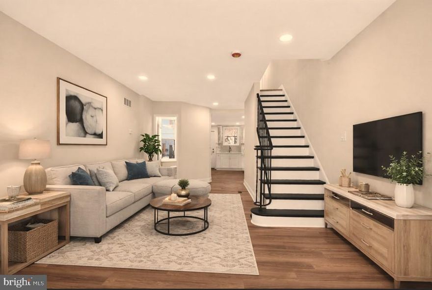 Beautifully renovated 3-bedroom, 1.5-bath townhome offering stylish modern finishes and abundant natural light throughout. The main level welcomes you with a bright open-concept layout featuring wood flooring, recessed lighting, and a seamless flow from the inviting living room to the dining area and into the stunning gourmet kitchen. The fully updated kitchen is a standout feature, showcasing premium white cabinetry, quartz countertops, stainless steel appliances, and custom tile backsplash, perfect for both everyday living and entertaining. Upstairs you’ll find three spacious bedrooms with wood flooring throughout and a beautifully renovated full bathroom featuring a custom Carrera marble ceramic tile surround, and all new modern fixtures.  Step outside to a private fenced backyard  a great space for relaxing, outdoor dining, or entertaining guests. Move-in ready and thoughtfully updated, this home offers the perfect blend of modern design, comfort, and low-maintenance living.