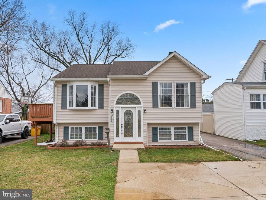 Nestled in the popular Baltimore Highlands community and offering living space on multiple levels is this traditional split level radiating light and space throughout.  As you step inside, you are welcomed by a hardwood foyer opening up to a living room enhanced by an architecturally angled ceiling, a double window and an ambient fireplace, followed by a light-filled dining room adjacent to the kitchen with a bay window and walkout to a wrap-around deck.  Enjoy preparing your favorite meals in the cook’s delight kitchen boasting granite counters, timeless crafted raised frame wood cabinetry, stainless steel appliances, ceramic tile flooring.  Upstairs discover the bedrooms including an owner’s suite presenting a lighted ceiling fan, a double closet, a glass slider walkout to an elevated deck, and a private redone bath.  Downstairs you find a family room, a full bath, a bedroom, additional storage, and a walk-up to the fenced yard.  Highly convenient location provides easy access to shopping, dining, recreation, a MARC station, and commuter routes.