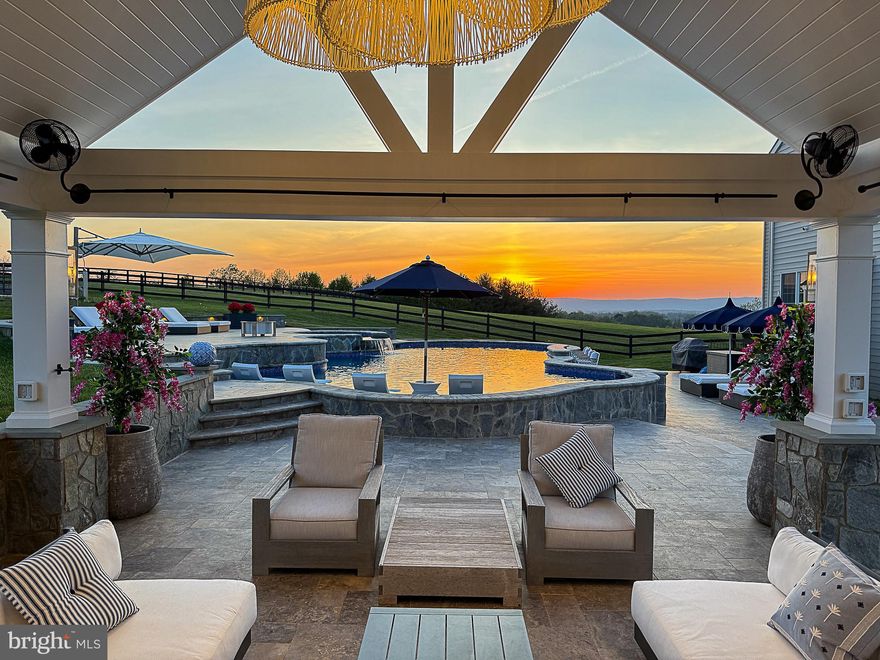 Estate home with NEW saltwater pool and outdoor entertaining space with sunset mountain views!  This updated 5-bedroom with 5 en suite baths upstairs spans 5,478 square feet above grade and is nestled on a sprawling 4.5 acre lot, offering unparalleled privacy and serenity.  Decorator touches and finishes including Restoration Hardware style.  Over $700K in improvements in the last 18 months! Newly refinished hardwood floors on main level.  Numerous updates including HVAC's (2023-2024). 

The newly renovated kitchen with Quartz counters, decorator subway tile backsplash, decorator lighting, new window overlooking the pool. Mudroom entrance with newly renovated laundry/mudroom with doggie wash.   New French door, TREX decking out to the pool area.  Reconfigured hallway to sunroom with new half bath.   Renovated Primary Bath with on-trend 12 x 24 tile, free-standing tub, white dual vanities with Quartz countertops, lighting/mirrors.  Delight in the grand family room, which features a stunning new 24-foot-wide floor-to-ceiling built-in.  Main-level study.  Each of the five bedrooms boasts an en suite bath, ensuring privacy and convenience. Additional features include a formal dining room, a charming porch, stone walkway and patio, a spacious 3 car garage.  Basement ready to be finished with your own vision.
Relax and entertain in style with the brand new custom saltwater pool, featuring a tanning shelf, swim-up bar ledge, and an elegant 8-foot spa.  Amazing sunset and mountain views from the pool or front patio area.  The multi-tiered pool deck offers distinct entertaining areas, while the pool house, adorned with an upgraded light package and an 8-foot gas fireplace, promises comfort and luxury. Sophisticated outdoor kitchen with marble countertop, complete with a 48-inch grill, pizza oven, and a bar that seats 10-12 guests comfortably.