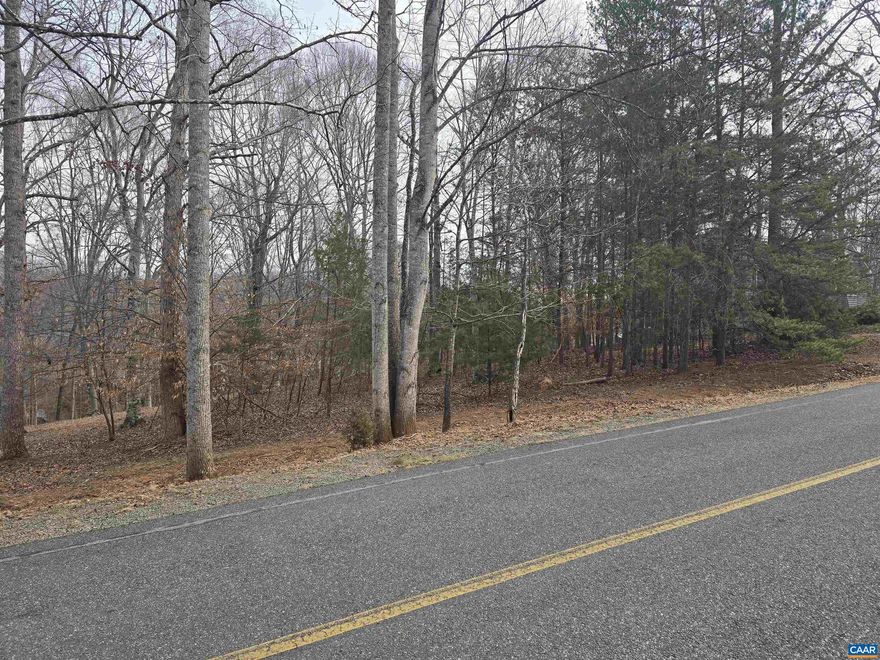 Rare opportunity to own 3.73 acres fronting on the golf course in Lake Monticello. This property is NOT part of the Homeowner Association at this time. Future subdivision will evoke HOA participation. Mature woods on property