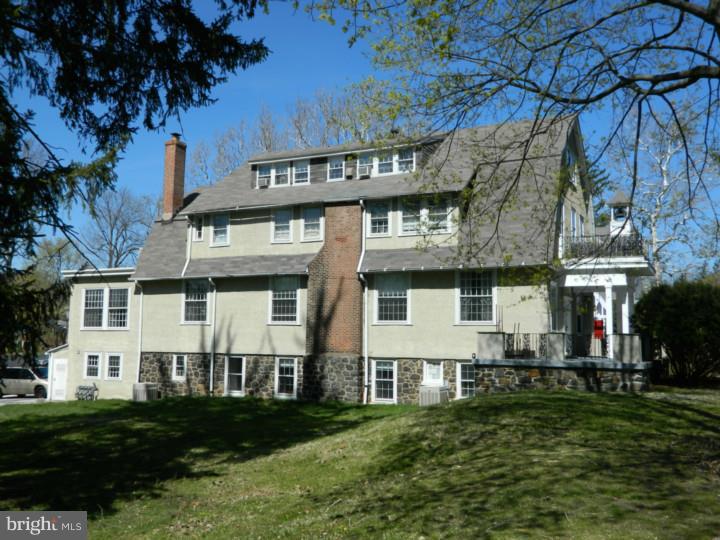 If you want a quiet setting, walk to TRAIN & Devon Horse Show- Welcome Home! Walk up to a cozy front porch & enter 1st door to a Mudroom, & then head through the charming Foyer, up the grand staircase to a landing with double door entry to this spacious 2nd Floor apartment, which includes the entire second floor of one of the grand homes- that was originally the Devon School! To the right are 2 Bedrooms, full bath, & handy closets. Walk Back down the hall to a large updated Kitchen w/ granite counters, new stove, & lots of cabinets. Handy office area & breakfast nook too. Large Laundry Rm w/ Pantry Area, & a full Bath is accessible from the Laundry/Kitchen area. Pass from Kitchen into a corner Dining Room, which has door to a lovely porch for morning coffee or evening cocktails, overlooking a level lovely side yard! Down the hall, pass windows with same peaceful views of Open Space on left, into a large Living Room. Flow continues thru the Living Room to a fabulous main bedroom with two large closets, a vanity/dressing area & tiled private Bathroom. This unit features updated baths & kitchen, & new paint throughout. Shared Foyer with 2 other units in building has wall of windows and views of St.John's Church - nice quiet neighbors! Rare Opportunity to live in a grand home in estate section of Devon - dogs OK per Landlord's approval, but no cats. Available immediately - INCLUDES: Exterior Building maintenance, private Parking, Lawn, Trash, & snow removal, Tenant pays for sewer, water, electric, heat, & cable. This is a sweet place to call home -it actually feels like a real house, across from million dollar homes and walk to train. Close to the soon to be completed Devon Yard, yet quiet and serene setting!