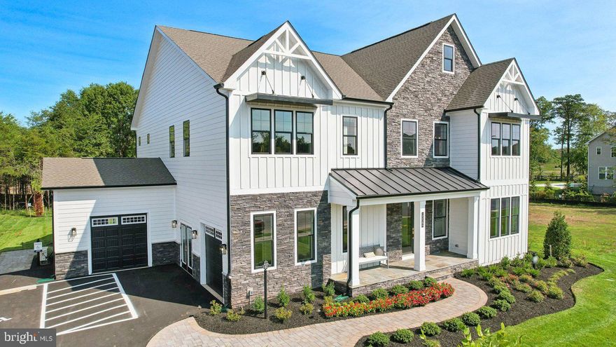 Designed with an extensive grand 2-story foyer, this home plan warmly greets your guests. Complete with dining, foyer, great room, primary bedroom & primary bath tray ceilings, the formal dining and flex room lead you to a spacious beamed ceiling great room, kitchen and first floor bedroom with full bath. The owners entry features built in cabinets and a private entry to the main level bedroom witj ensuite full bath. All bedrooms have their own private baths and walk in closets.  The expansive Primary suite has dual walk in closets, sitting area and primary grand bath including a free-standing tub and spa-like shower. This design offers a finished recreation room and the basement bedroom and full bath are complete for your convenience.  Huge 4 car garage. April - May  Delivery!
 Up to $10,000 total closing cost is tied to the use of DHI Mortgage.
*Photos, 3D tours, and videos are representative of plan only and may vary as built.*