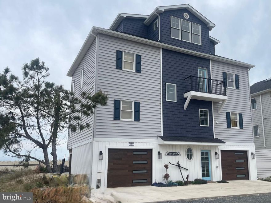 Nearly New Construction Without the Wait on Broadkill Beach!
Built in 2024 along the gentle shores of the Delaware Bay, this stunning home features a bright, open floor plan with sweeping views stretching from Lewes to Cape May. Step inside to discover a thoughtfully designed interior that perfectly balances elegance and warmth.
The reverse floor plan maximizes the breathtaking water views, offering main-level bedrooms and a second level that includes a gourmet kitchen with stainless steel appliances, along with spacious dining and living areas. A widow’s peak third floor with a wet bar and beverage station provides the perfect setting for entertaining or watching the sunrise over the bay.
Boasting 2,600 square feet, 3 bedrooms, and 4 full baths, this property offers ample space for family and friends to spread out, while also serving as an attractive beach rental opportunity.
The lower level features a 2-car garage, Tesla charger, two outdoor showers, and a fenced yard complete with games and a fire pit. Rental revenue exceeded $110,000 in 2025 and is on track to achieve similar income in 2026.
Offered furnished, with minor exclusions, this turnkey property is ready for your summer adventures.
Welcome Home!!