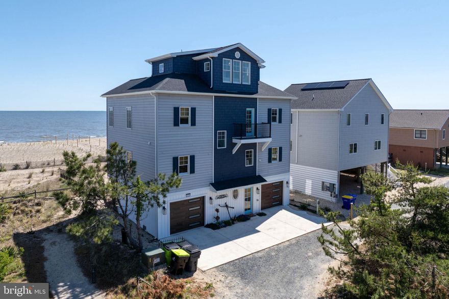 Nearly New Construction Without the Wait on Broadkill Beach!
Built in 2024 along the gentle shores of the Delaware Bay, this stunning home features a bright, open floor plan with sweeping views stretching from Lewes to Cape May. Step inside to discover a thoughtfully designed interior that perfectly balances elegance and warmth. The homeowner is a small custom home builder who originally built the home for personal use, culminating in attention to detail.
The reverse floor plan maximizes the breathtaking water views from the Andersen windows, offering main-level bedrooms and a second level that includes a gourmet kitchen with stainless steel appliances, along with spacious dining and living areas. A widow’s peak third floor with a wet bar and beverage station provides the perfect setting for entertaining or watching the sunrise over the bay.
Boasting 2,600 square feet, 3 bedrooms, and 4 full baths with custom work, this property offers ample space for family and friends to spread out, while also serving as an attractive beach rental opportunity.
The lower level features a 2-car garage, Tesla charger, two outdoor showers, and a fenced yard complete with games and a fire pit. Rental revenue exceeded $110,000 in 2025 and is on track to achieve similar income in 2026.
Offered furnished, with minor exclusions, this turnkey property is ready for your summer adventures.
Welcome Home!!