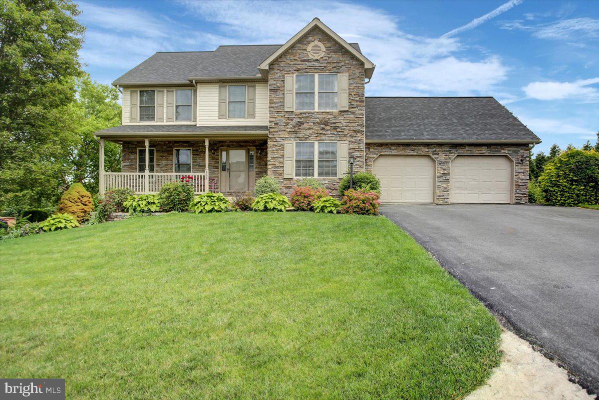 Beautiful home in a desirable neighborhood. Walk thru the open foyer to the bright living room and formal dining room featuring wood floors. Kitchen with island and appliances, opening to the family room with fireplace, plus half bath. Second floor boasting a primary bedroom with walk in closet, and a full bath with double sink vanity. 3 additional bedrooms, and full bath, plus laundry area. Possible in-law quarters in lower level with finished living area, kitchenette and laundry. Lower level work shop and storage. Beautifully landscaped yard with split rail fencing, 2 car garage, deck for entertaining, raised garden beds and more! There isn't much this home doesn't have to offer! Come check it out today!