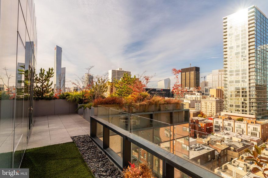 Welcome to an exclusive Pent House for rent steps away from Rittenhouse Square. Stunning multi-level, 5-bedroom 5½ bath condominium in the architecturally acclaimed boutique building, 2110 Walnut. Pass through the passcode-protected entryway and ascend to the 9th floor. The elevator doors open to your oasis, with light animating the wide, open floor plan grounded in a refined palette of large format tiles and natural wide-planked floors and surrounded by inviting views from wraparound terraces. A connected and brightly tiled back kitchen provides convenient access to your array of ingredients and working space for kneading dough or making a silky cappuccino, with superior commercial level storage. The family room, highlighted by a deeply toned, hand-applied Venetian plaster wall, is further warmed by a linear gas fireplace and offers access to the spacious Southern-facing terrace. High walls, evergreen, and seasonal plantings, and soft landscape lighting offer transcendent views, while the built-in Viking gas grill extends the informal entertaining experience. The dining area is framed by walnut slatted millwork and cast aglow in evenings by custom overhead lighting and a long table that beckons guests to feel welcome. Steps away but far enough from the active family area to be utilized as an independent office, playroom, or television room, this space enjoys access to the deep northern and eastern-facing terraces. Ideal for lounging, outdoor exercise or, as this active family used it, a year-round garden offering strawberries, wildflowers, and summer tomatoes Descend the glass, steel and wood staircase or take the elevator to the 8th floor. The continuity of the lightwood flooring makes for four dreamy large bedrooms, each with top-level ensuite baths and outfitted closets. The stellar primary suite offers a soft, minimalist appeal. The views keep you in touch with the city, but the careful selections of wall-hung lighting and nightstands, storage console, and automated blinds offer effortless, peaceful livability. Adjacent is a large, bright marble bath with radiantly heated floors and detailed with an under-window soaking tub, streamlined double vanity, oversized seated shower, and separate water closet. Two separate walk-in closets exceed all expectations for hanging, drawer, and flat storage. This floor features a custom-built spectator bar for happy hours. Also on this level is another large office (or 5th bedroom and full bath!) with limitless views beyond the full glass wall, sure to inspire even the most work-weary. The top level, floor 10, is outfitted with a beverage bar and refrigeration, with a sliding glass door to the rooftop terrace offering sweeping views of the city.