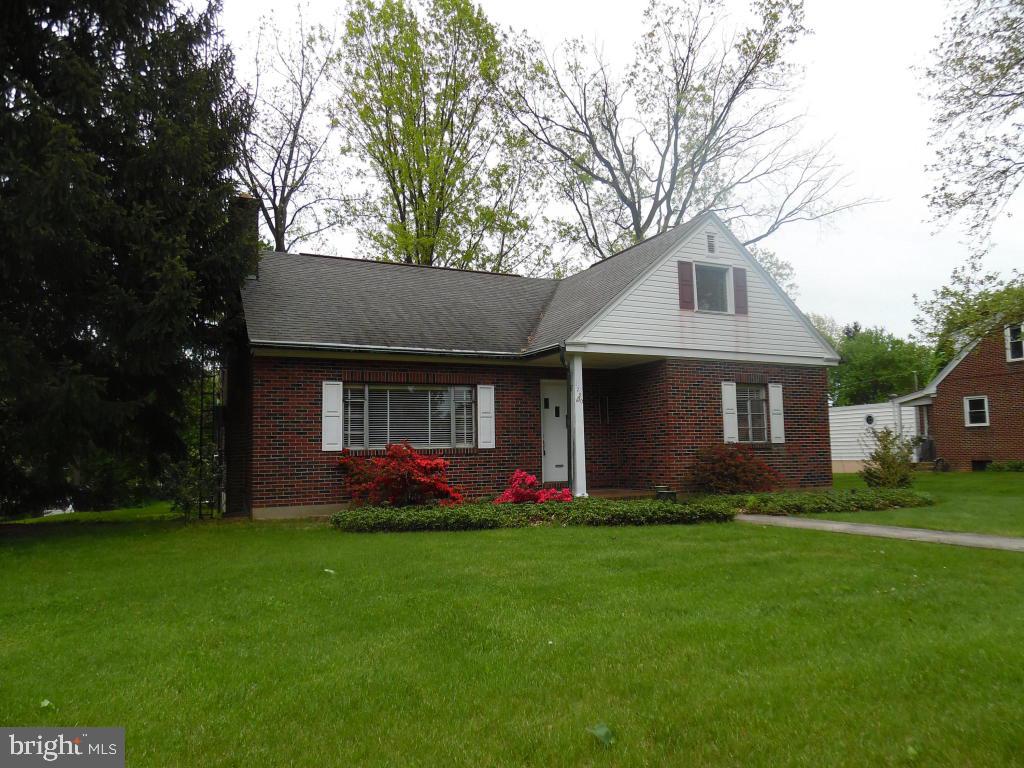Solid brick rancher on delightful lot close to everything!This home has a surprising open floor plan, large kitchen and bedrooms and a delightful heated sunroom. The second floor is a large attic just waiting to be finished, and the basement has a family room, laundry, storage room and garage. Hardwood floors throughout, recent heating system, upgraded electric, newer roof on a lovely lot. The wood burning fireplace adds to the charm!
