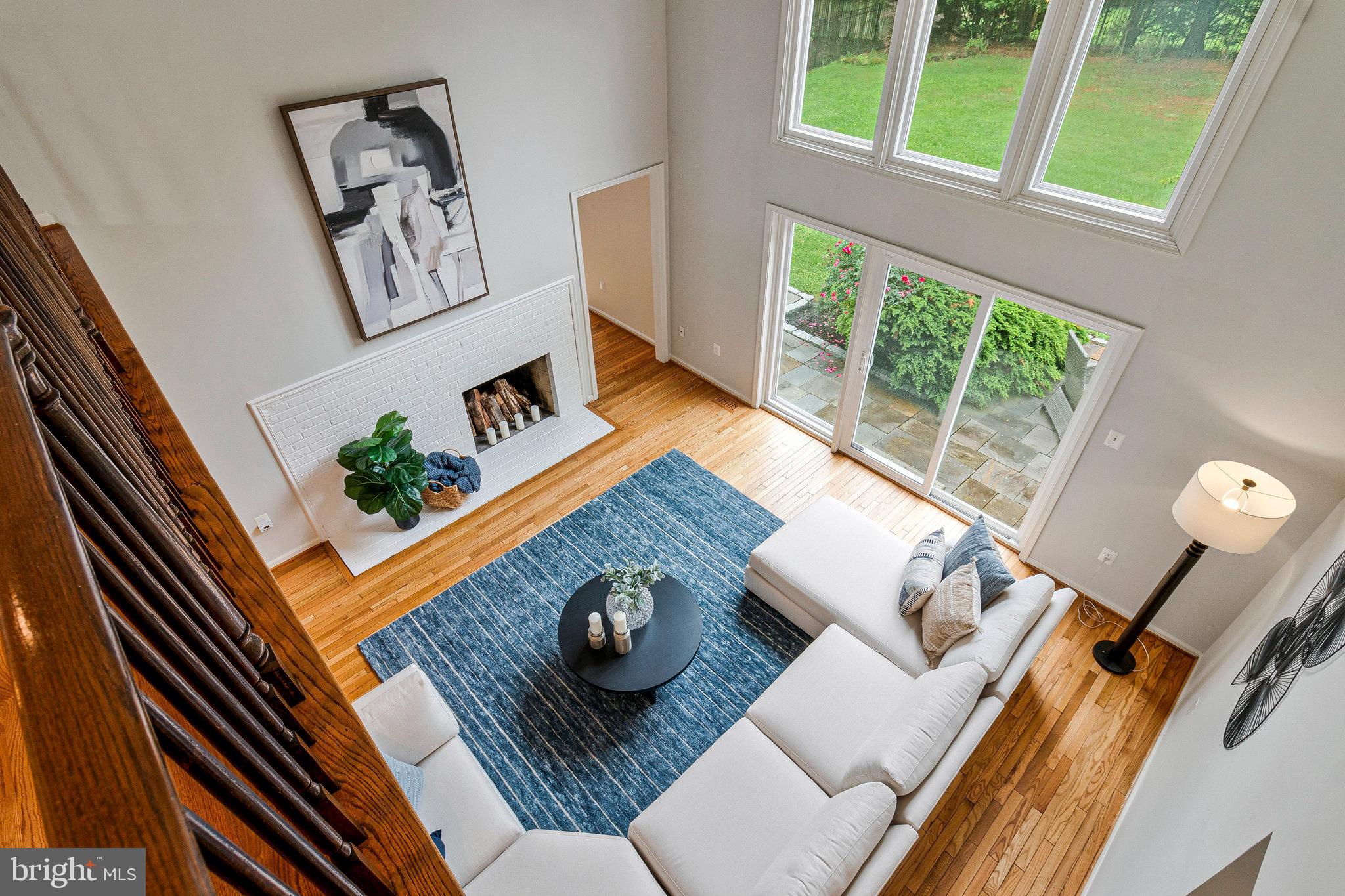 Step into this timeless Classic Colonial, thoughtfully updated and perfectly positioned in Potomac’s exclusive Falconhurst neighborhood. Set on a flat 0.46-acre lot, this 6-bedroom, 4.5-bath home offers a blend of sophistication and comfort, with beautifully appointed interiors and a backyard designed for both relaxation and entertaining. A stately brick exterior and flagstone walkway welcome you home, while mature trees and lush landscaping surround the property, ensuring peace and privacy. The flagstone patio off the kitchen extends your living space outdoors, and the fully fenced backyard creates a private haven for gathering, play, or quiet moments.
Inside, the home is filled with natural light and offers an inviting, open layout. Refinished hardwood floors and tasteful lighting add warmth and elegance throughout much of the main level. A striking two-story foyer greets you with marble-style porcelain tile, a dramatic curved staircase, sidelights, and an atrium window accented by a decorative oval detail. The living room features a wood-burning fireplace with a marble surround, oversized windows, crown molding, recessed lighting, and sliding glass doors that bring the outdoors in. The formal dining room is beautifully appointed with crown molding, chair rail, tall front-facing windows, and a contemporary chandelier. A private office, complete with built-in bookcases, a closet, and generous windows, offers a quiet retreat for work or study.
The renovated kitchen is both stylish and functional, featuring 42” white cabinetry with crown molding, stainless steel appliances, quartz countertops, and a spacious center island with bar seating and elegant pendant lighting. A marble backsplash adds texture, while a bay window with built-in seating creates a cozy nook for casual dining. The adjoining breakfast area opens directly to the rear patio for effortless indoor-outdoor flow. The show-stopping two-story family room is bathed in natural light and anchored by a second wood-burning fireplace with a painted brick surround and sliding glass doors leading to the backyard. Also on the main level are a chic powder room with a marble-topped vanity and porcelain sink, and a laundry room with front-load washer and dryer, utility sink, and ceramic tile flooring.
Upstairs, a spacious landing with views of the two-story family room connects to four generously sized bedrooms. Bedrooms 2 and 3 feature new carpet, fresh paint and share a beautifully updated Jack & Jill bathroom. Bedroom 4 enjoys the privacy of its own ensuite bath, also renovated, along with a large closet. The expansive primary suite is a true retreat, offering two walk-in closets and a luxurious spa-inspired bath complete with a walk-in shower, elegant soaking tub, double vanity, ceramic tile flooring, modern lighting, and abundant storage.
The fully finished lower level offers versatility and style, featuring new luxury vinyl plank flooring, fresh recessed lighting, and a spacious recreation area perfect for relaxing or entertaining. A fifth bedroom includes a closet, egress window, and flexible space ideal for a home office or study. A full bath with an updated vanity, tiled shower, and modern fixtures provides added convenience. Ample storage completes the lower level.
This exceptional home in Falconhurst blends classic elegance with modern updates in a serene yet accessible setting—just minutes from Potomac Village, top-rated schools, parks, and major commuter routes.
Experience the best of Potomac living in a home that welcomes you with both charm and comfort.