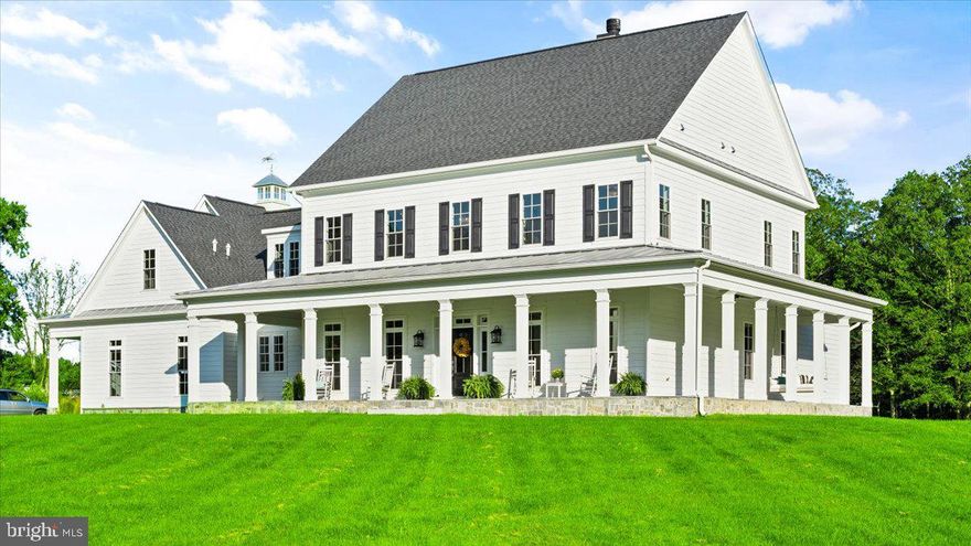 LIVE YOUR BEST LIFE! If you are looking for a luxurious home with beautiful craftsmanship on a stunning lot with SPECTACULAR SUNSET AND PASTORAL VIEWS, be prepared to fall in love! This Incredible CUSTOM BUILT HOME designed by award winning Architect Timothy Bryan is featured in Southern Living & Better Homes & Garden! This MODERN AMERICAN FARMHOUSE offers the best blend of classic design and comfort with NO HOA so you have the space and freedom to make all your dreams come true! 

Sited on TWO PARCELS for a total of 15+ pastoral acres with your own PRIVATE POND, this home truly is a SHOWSTOPPER! The exterior of the home is aesthetically pleasing with a handsome white composite exterior, a welcoming wrap around porch with a stone floor and distinct architectural details from every view! The interior is both elegant and inviting with 10' foot ceilings on the main floor, solid doors, intricate molding and trim work and upgraded wood flooring. The library at the front of the home offers a handsome fireplace as the focal point and custom built bookcases. Entertain family and friends in the separate formal dining room with an elegant butler's pantry. The family room is centrally located in the home and features a wood burning fireplace. Adjacent to the family room is the sunlit gourmet kitchen with white cabinetry, upgraded counters and stainless steel appliances. The kitchen also features a large pantry as well as an an office nook with a custom barn door. Additionally, there is a large family utility room off the kitchen with a 2nd front door entrance with plenty of cabinet storage, laundry room and a doggie shower.  You will love the beautiful MAIN LEVEL OWNER'S SUITE with his and her walk in closets and a luxurious bath with Carrara marble and a soaking tub. *** The upper level features an additional 4 bedrooms and 5 full private baths as well as a 400 square foot bonus area over the garage ideal as a playroom or 5th upper level bedroom. Amazing care ad attention to detail is visible throughout the house including the custom staircase, an upper level loft and laundry chute and so much more! The walk up lower level offers a spacious recreation room with a gas fireplace perfect for entertaining plus an additional 7th bedroom, full bath and a secondary kitchen ideal for an in-law suite! Enjoy BEAUTIFUL BREEZES AND COMPLETE PEACE AND QUIET with sweeping views of the mountains, pastoral fields and pond. The home additionally offers a covered rear porch and a leveled backyard making it the ideal backdrop to all your future outdoor projects. All this and you are just a few minutes from all of Leesburg's best shops, restaurants, wineries, breweries and Downtown area! You get to enjoy the 'small town' feel but still have access to all of the conveniences that you need! Property is in land use.