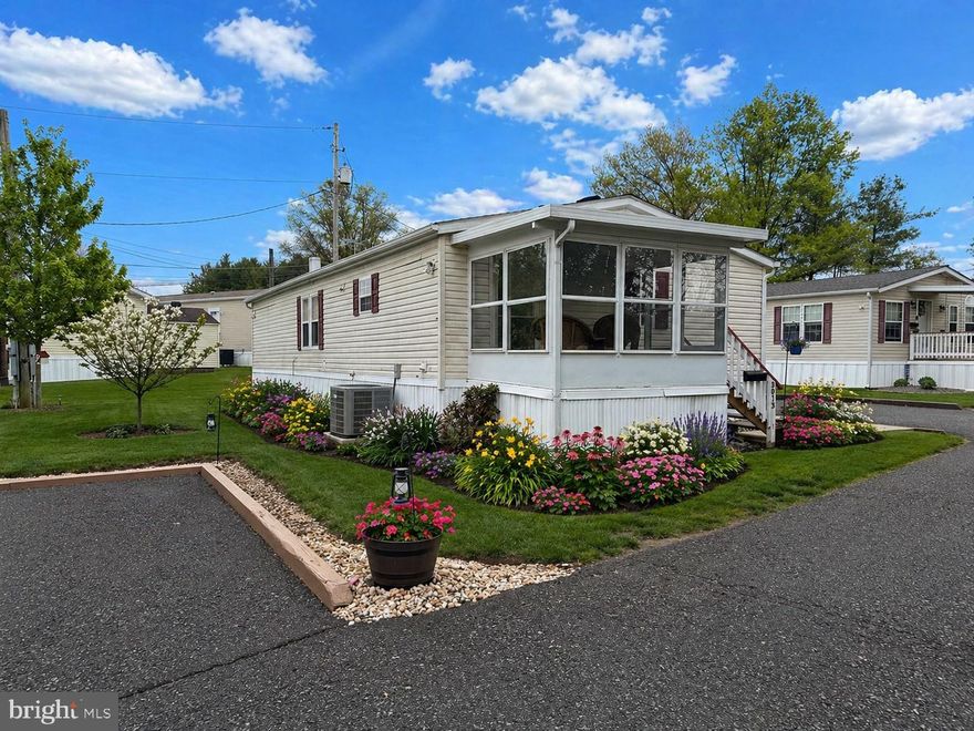 Welcome to this beautifully situated home in the desirable 55+ community of Rockhill Village in Telford. Nestled on one of the most private lots, this property backs to serene fields and mature trees, offering peaceful views and the perfect setting to enjoy your morning coffee or unwind while watching the birds.
An oversized sunroom—surrounded by windows on three sides—fills the home with natural light and provides a wonderful space for relaxing, entertaining, or gardening enthusiasts to enjoy year-round sunshine.
Inside, the flexible and spacious living room features vaulted ceilings, a cozy fireplace, and large windows that brighten the entire space. The layout easily accommodates a variety of furniture arrangements to suit your lifestyle.
The eat-in kitchen offers ample cabinetry, a newer stove, and flows seamlessly into the dining area—perfect for everyday living or hosting guests.  
The main bedroom suite includes a private bath with a full tub, shower, and vanity. A generously sized second bedroom features a sitting area, oversized closet, and convenient access to the
 full hall bath.
Storage is abundant throughout, including spacious bedroom closets, an oversized hall closet, a laundry room, and an exterior storage shed.
Additional updates include newer windows, a newer water heater, and an HVAC system updated in 2015.  Recently installed new carpet in bedroom and Luxury LTV floors throughout.
Ideally located near local restaurants, grocery stores, and the library, this home offers both comfort and convenience in a peaceful community setting.