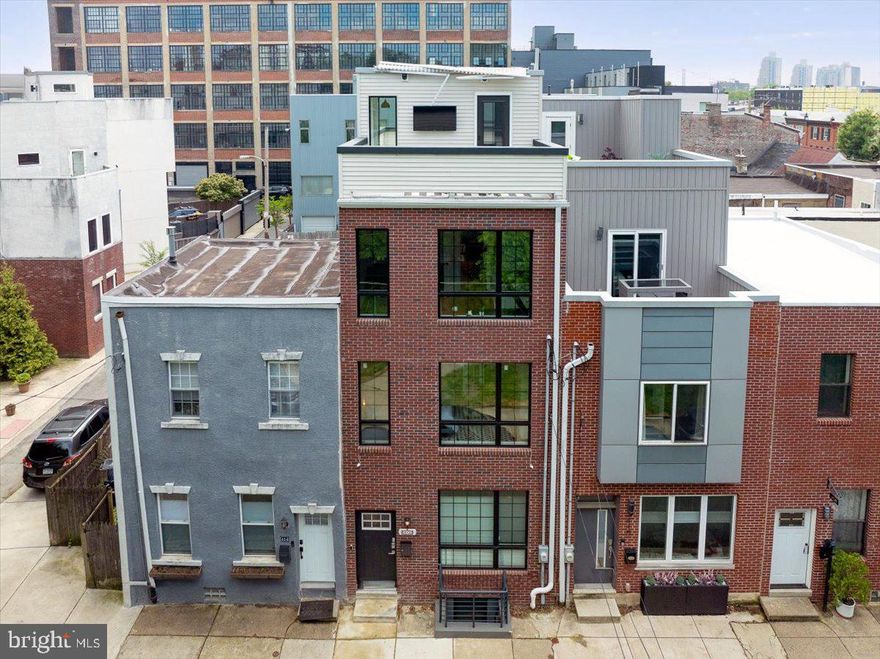 This is an amazing opportunity to purchase a one of a kind home located directly across the street from Palmer Park in the heart of Fishtown. The owner spent years lovingly creating this 4 bedroom, 3.5 bathroom home and spared no expense planning this unique customized property. The attention to detail is spectacular with custom finishes and high end materials that all came together in this exceptional place to call home. Upon your arrival at the home, you will love the beautiful curb appeal, tall windows, and convenient location. When you open the front door, you will have direct access to the first floor as well as the fully finished basement. The first floor has a living room, full kitchen and modern half bathroom. The kitchen features a full KitchenAid stainless steel appliance package, butcher block counter tops, tile backsplash, beautiful knobs, a farm house sink, and tons of cabinet space. There is a door in the kitchen that leads to the private rear patio. The second floor boasts the primary bedroom, primary bathroom, full size laundry, and built in wardrobe.  The primary bathroom has a large soaking tub, walk in shower with subway tile, private wash closet, custom tile floor, and a custom dual sink vanity. The third floor offers two bedrooms and a full bathroom. The basement includes a living space, full bathroom, and kitchenette, plus its own separate entrance, making it perfect for use as an in-law suite, guest suite, additional bedroom, or an additional living space. The top floor offers access to both rooftop decks. There are three separate outdoor spaces consisting of a private fenced in rear patio and two rooftop decks with amazing views of the city and skyline. The rear roof top deck features a retractable awning and wall mounted television perfect for watching your favorite game or the occasional fireworks. This residence also features hardwood floors, recessed lighting, custom ceiling fans, various custom touches, multi zone HVAC system, and built-ins! Property not being offered furnished. However, the Seller would be negotiable on leaving the furnishings behind. Property has 10 year real estate tax abatement in place until 12/31/2033. Buyer to contact City of Philadelphia for any additional information pertaining to tax abatement.