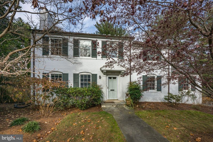 Ideally located in Spring Valley, this distinguished 4bd, 4.5ba colonial pairs classic architecture with gracious, well-scaled living on a large, private lot. A traditional floor plan unfolds with elegant living and dining rooms, each thoughtfully designed for both formal entertaining and everyday comfort.
At the heart of the home, an expansive eat-in kitchen offers exceptional space for gathering, dining, and daily living. Bathed in natural light and overlooking the beautifully landscaped backyard, with access to a featured Ipe wood balcony off the kitchen, it serves as a central hub—equally suited for casual mornings, family meals, or effortless entertaining. The main level also features a sought-after den with a separate office, providing additional flexible space for reading, working, or studying. 
Upstairs, three well-appointed bedrooms and three full bathrooms include a generous primary suite with an ensuite bath, as well as a guest bedroom with its own ensuite bath. The lower level adds valuable living space and versatility, featuring a recreation room, laundry area, ample storage, full bath, and a flexible fourth bedroom, or bonus space—ideal for guests, a home office, or a fitness room—with direct access to the backyard. An attached garage adds everyday convenience.
Outdoors, the property offers a true resort-style backyard retreat. The spectacular pool and surrounding grounds create a private oasis, perfect for summer entertaining and quiet relaxation.
Just moments from Spring Valley favorites such as Millie’s, Compass Coffee, and neighborhood conveniences, 4238 50th Street NW offers a rare blend of location, scale, and timeless appeal—an elegant residence designed for refined living in one of Washington’s most desirable communities. Welcome home!