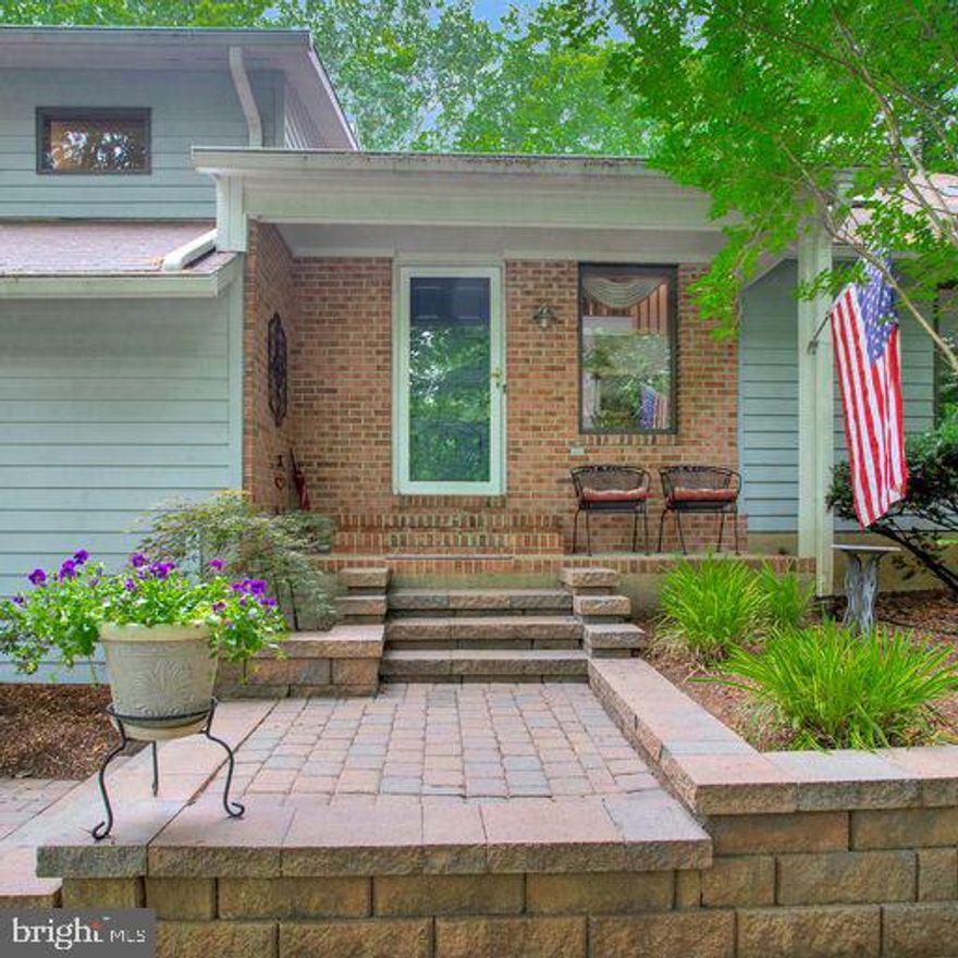 Welcome to 1185 W Mahogany Ln in beautiful Crownsville, MD. This stunning, 4 bedrooms, 3.5 bath is situated on property that offers a perfect blend of style, comfort and modern living in the sought-after community of Severn Landing. This home is sure to impress with its great design and  thoughtful features. The exterior of this house boasts a timeless architectural style and  is surrounded by a beautifully landscaped front yard complete with retaining walls, stone walkways and steps skillfully designed and constructed to add an element of elegance and functionality to the landscape. Step inside and be greeted by a well-designed interior that exudes warmth and sophistication. The contemporary floor plan creates a seamless flow between the different living spaces, promoting a sense of spaciousness and connectivity. 
The hardwood flooring and  high ceilings adding a touch of luxury. The main level of the home offers a generous living room, perfect for entertaining or spending quality time with family and friends. The adjacent dining area provides an ideal setting for formal dinners or casual gatherings, while large windows invite natural light to illuminate the space. The well-designed, renovated kitchen features granite countertops, a center island and  beautiful cabinetry. With ample counter space and storage, it is both functional and aesthetically pleasing, making it a chef's dream come true. Move from the kitchen into the cozy great room designed with both relaxation and entertainment in mind. It’s focal point is a fireplace which creates a welcoming atmosphere on cooler evenings and instantly gives the space a sense of warmth and comfort. Large windows frame the picturesque scene, allowing abundant natural light to flood the room and provides a seamless connection between indoor and outdoor living. Step outside into your own private oasis. The backyard offers a haven for outdoor living and  entertaining. The deck is just perfect for hosting gatherings or simply enjoying the tranquility of the surroundings. The gentle rustling of leaves, the chorus of birdsong & the scent of fresh air combine to create a sensory experience - The spacious and grassy backyard also provides plenty of room for children and pets. The home offers four well-appointed bedrooms, including a luxurious owner’s suite. As you ascend to the dedicated master bedroom level, you'll immediately notice the sense of separation and seclusion from the rest of the home. The master suite encompasses an entire floor, ensuring ultimate privacy and a tranquil atmosphere. The secondary rooms offer generous space and  share the full hall bath. The finished lower level of this stunning single-family home provides additional living space and  has been thoughtfully designed and  meticulously finished to provide both functionality and  comfort for you and your family. This versatile space can be transformed into a cozy family room, a vibrant game room, offering endless possibilities for relaxation & entertainment. For added convenience and comfort, the lower level includes a full bathroom. The home offers plenty of room for vehicles w/ attached car garage parking, large hardscaped parking - just perfect for overflow parking, storing boats or recreational vehicles.  Whole home generator offers peace of mind for a reliable back up power source.  Severn Landing offers voluntary membership to Palisades on the Severn which offers an array of waterfront amenities designed to enhance your lifestyle and  provide endless opportunities for outdoor enjoyment. From a sandy beach to kayak/canoe/paddleboard storage, a pavilion, playground and  a community pier - there's something for everyone to embrace the beauty of the surroundings & foster a strong sense of community. Nestled in Crownsville, MD, this home offers a peaceful and private setting while being conveniently located near schools, parks, shopping, dining/entertaining. Don't miss out!