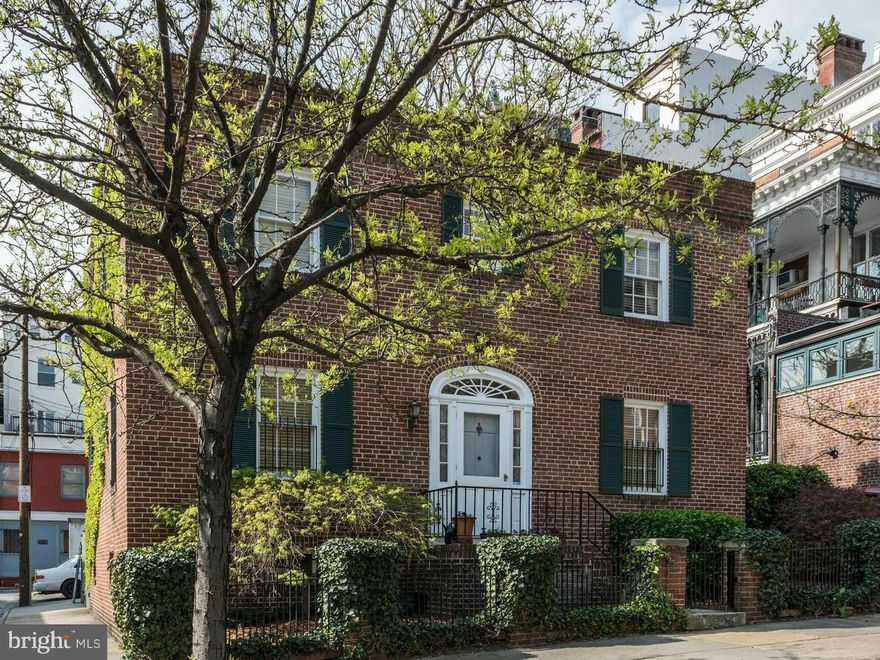 Rare brick carriage house in the heart of Mt. Vernon! This architecturally classic home has gleaming hardwoods & over sized living room w/ cozy fireplace & custom built-in bookshelves. Fully updated gourmet kitchen w/ stainless steel appliances & granite counters. Spacious, sun drenched bedrooms. The charming rear courtyard w/ gorgeous garden, pond & brick patio are perfect for entertaining!