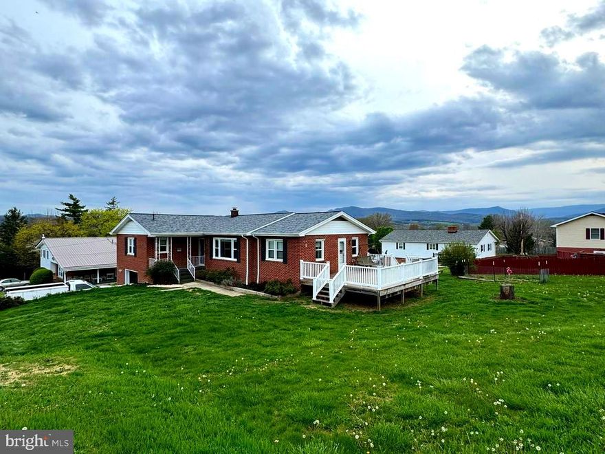 This home is conveniently located in the heart of town. With huge bay window the living room gets tons of natural light and helps the original hardwood floors really shine. The tile back splash in the kitchen sparkles and shines adding a pop of cheer to your dinner routine. This home is build for total comfort and convenience. From the automatic lights in the closets and tankless hot water heater, to the laundry chute! Don't forget the wifi thermostat with red link censors to keep  the most even temperatures throughout. With a built in garage you don't even have to go out in the rain to get in your car! All that perched on a double corner lot!