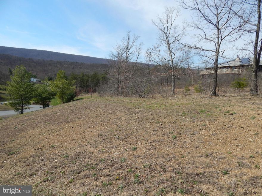 SPRING SALE!! 1.21 AC in Prestigious Cacapon South. Featuring paved roads & mt. views, this is the perfect location for full time or weekend retreat. Across the street from 6115 Ac State Park featuring golf+swimming+paddle boats+horseback riding+skeet shooting+playground+tennis+basketball+volleyball+restaurant Located 10 M South of Berkeley Springs & w/in 20 M of Winchester, VA for easy commuting