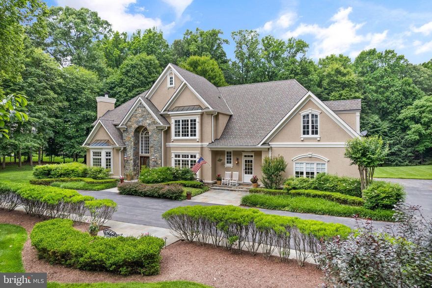 Welcome to this grand, 6 bedroom, 6 .5 bathroom, 7,400+ Potomac home, gracefully situated on a private 2+-acre lot. The first floor is designed for both elegance and functionality, featuring a grand foyer, an elegant living room, and a formal dining room. The open kitchen and family room create a warm and connected space, perfect for daily living and entertaining. A wood-paneled office provides a refined workspace, while a powder room, full bathroom, and mud room offer additional convenience. Completing this level is a three-car garage, providing ample storage and parking. Upstairs, indulge in the expansive private suite, complete with two walk-in closets, wonderful bathroom with large tub and shower, and an attached office or sitting area. Four additional bedrooms, including a guest suite wing, offer plenty of space for family and guests. The large basement enhances the home’s versatility with a bar area, a generous recreation space, a bedroom, a full bathroom, and a bonus room perfect for a gym or office. Outside, the property boasts a 3-car garage and amazing outdoor space with a flat yard and a beautiful flagstone patio, ideal for relaxation and entertaining. To top it all off, the owners will convey plans for a pool, promising even more enjoyment in this stunning home.