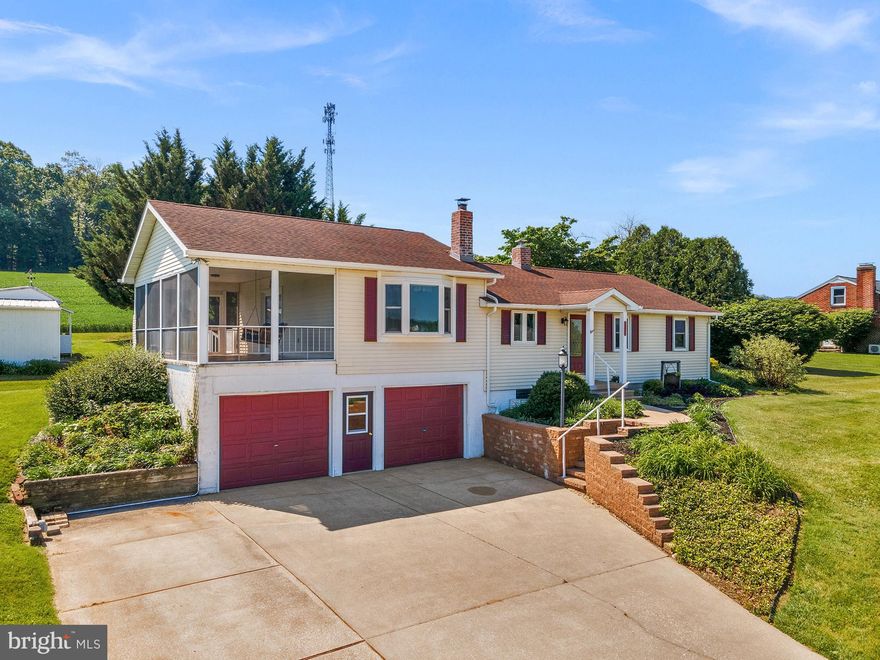 Open House this Saturday (5/23) from 1-3PM!! Tucked on a hillside in desirable Manchester, 2837 Traceys Mill Rd offers breathtaking panoramic views of the surrounding hills, farmland, and valleys. The sky is endless here, and so too is the meticulous care and maintenance that has gone into this delightful raised ranch home! The eat in kitchen features plenty of table space and stainless appliances. The large family room addition features a soaring ceiling, amazing natural light and large windows to take in those views, and access to a wonderful screened in porch where the hours will melt away as you take in the pastoral vista and quiet countryside. The full bath has been redone and features beautiful tile and a large walk-in shower. Three bedrooms have lovely hardwood flooring throughout. Downstairs, the unfinished basement provides lots of storage, laundry, a cozy wood stove, and access to your two car garage. The driveway also has a camper/RV 50amp service and parking pad. The tidy half acre lot has been wonderfully landscaped over the years with mature and thoughtful flora and fauna. Sheds provide additional storage. With a new furnace in 2024, new oil tank 2023, central AC unit 2022, and new roof 2013, all the major systems are updated and ready for you to move in without a worry!