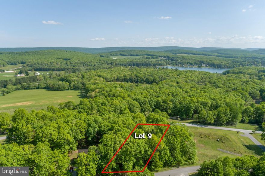 Serene one acre building lot at Deep Creek Lake - Located near beautiful Sky Valley, you'll enjoy a private setting with rolling mountain views. Only minutes from Thousand Acres golf course, and close to all of the areas establishments and 4-Season Outdoor Recreation.  Approved for a three-bedroom septic system, the only thing this property's missing is your dream home.  Call today for details!