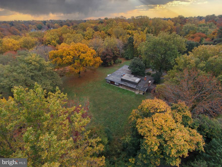 Live authentically. Truly an exceptional piece of land.  Two small overgrown ponds. Former sheep farm. 8.15 acres of rolling hills & total privacy. Mid century house in need of total renovation or removal. Two outbuildings. Estate living in town. Value is in land. Do not visit property without appointment. Tenant occupied. Unique setting that you can't repeat. Quite remarkable that this even exists. Walking distance to the gorgeous trails arond Lake Roland.  An oasis in the county. Moments from everywhere you want to be. Realize your vision. The art of uniting human and home. House is severe disrepair no interior showings at that time. Photos are for inspiration only.