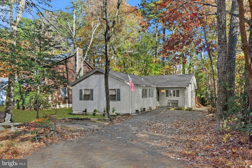Welcome to 22 Rabbit Run Lane, a delightful 3-bedroom, 2-bath home nestled in the amenity-rich community of Ocean Pines. This home offers peace of mind with major updates already completed, including a new roof (2022), new HVAC (2023), and new water heater (2020). Recent interior improvements include fresh paint inside and out, new carpet in the foyer and secondary bedrooms, new kitchen flooring, and luxury vinyl plank in the living room. The inviting kitchen features a stylish design with white upper cabinets and blue lower cabinets, a stylish backsplash, ample storage pantry, and a dining area large enough to host family and friends. Sliding glass doors from both the kitchen and living room lead to a spacious back deck, perfect for outdoor relaxation or entertaining. The living room is centered around a cozy fireplace, creating a warm and welcoming space to unwind. Located in the sought-after Ocean Pines community, residents enjoy access to multiple swimming pools, walking trails, sport courts, clubs, and countless activities, all just minutes from Ocean City’s beaches, dining, and entertainment.
***Possible assumable loan option for qualified buyers***