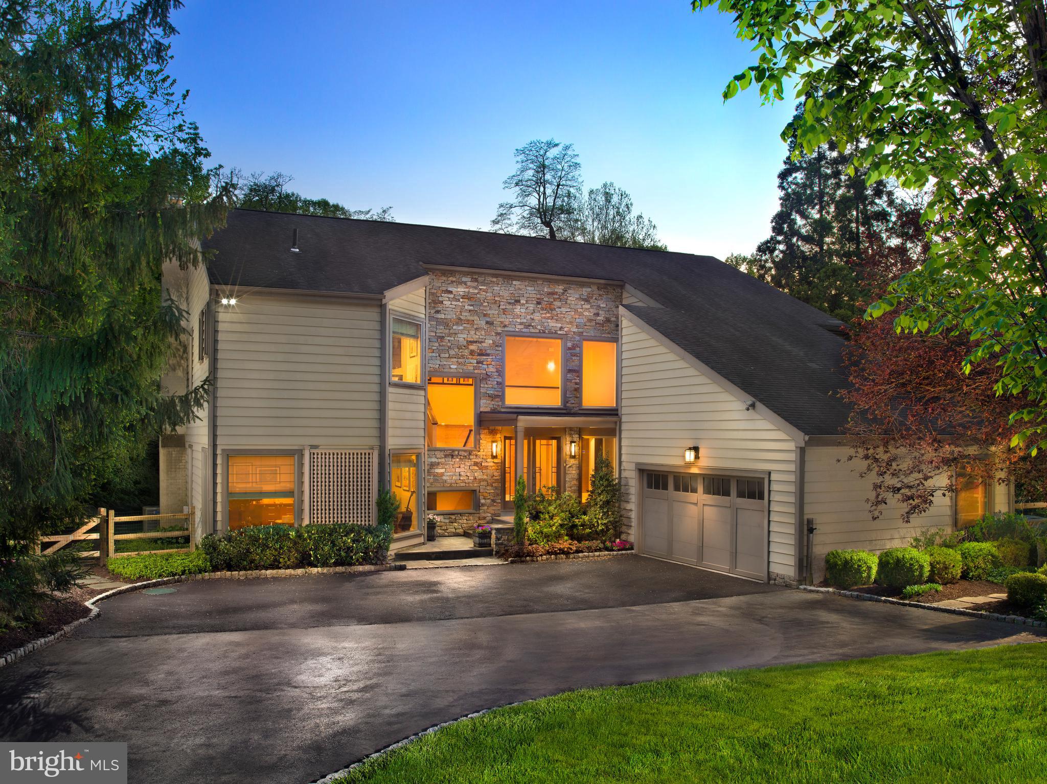 Welcome to 1136 Springmont Circle, a beautifully updated contemporary home located in the highly sought-after north side of Bryn Mawr. Tucked away on a peaceful cul-de-sac, this spacious property effortlessly blends comfort and style, set amidst nearly an acre of lush, park-like surroundings.
Upon entering, you'll be greeted by an inviting two-story foyer that sets the tone for the home's elegant yet cozy atmosphere. The standout chef’s kitchen is equipped with high-end Viking and Sub Zero appliances, a large island, designer cabinetry, and sliders that lead directly to the pool area, making outdoor entertaining a breeze. The kitchen seamlessly connects to a dedicated laundry room, ensuring convenience and practicality.
Next to the kitchen, a charming sitting area with a bar provides the perfect spot for hosting friends and family. Relax in the spacious family room, featuring vaulted ceilings, a stacked stone fireplace, and stunning views of the backyard.
The formal dining room, with its ample size and delightful fireplace, is perfect for gatherings and special occasions.
The master suite is a true retreat, featuring a luxurious bathroom and an expansive walk-in closet. Step outside to your private oasis, complete with a pool, hot tub, and a stunning IPE wood deck—ideal for both entertaining and unwinding.
With four spacious bedrooms upstairs and a finished basement offering a fifth bedroom and full bathroom, there's ample space for everyone. Altogether, the home includes four and a half bathrooms and two convenient powder rooms—one formal and another for poolside use—spread across more than 4,500 square feet.
Meticulously maintained, 1136 Springmont Circle is a gem that beautifully merges modern features with timeless charm. Don't miss the opportunity to make this exceptional home your own!