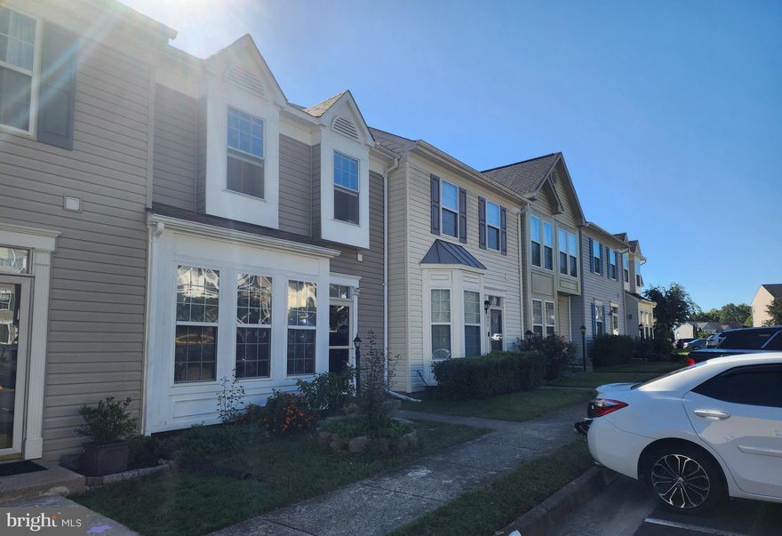 Nestled in the serene community of Lake Terrapin/Ridgefield, this beautifully maintained townhouse combines comfort, style, and practicality perfect for homeowners and investors alike. With a major renovation completed in 2022, this home showcases thoughtful updates across its 1,988 square feet of living space. Step inside to find a bright and open floor plan that seamlessly connects the living and dining areas, featuring rich hardwood floors on the main level and soft carpeted stairs. The kitchen offers an inviting space for everyday living and entertaining, complete with an island, ample cabinetry, and a mix of renewed and original appliances—including a gas range, built-in microwave, and dishwasher. The breakfast area is filled with natural light, creating a cozy spot for morning coffee. Upstairs, the hardwood floors continue through the hallway and bedrooms, including the spacious primary suite with a walk-in closet and a spa-inspired en-suite bathroom. With three full bathrooms and one half bath, comfort and convenience are built into every level. The fully finished basement features laminate flooring and a walkout entrance, offering flexible space for a home office, gym, or recreation room. Additional updates include a new roof (2022) and new water heater (2023), providing peace of mind for years to come. Enjoy outdoor living on the expansive deck overlooking a fully fenced backyard—perfect for entertaining, gardening, or relaxing in privacy. The community amenities further enhance the lifestyle, including a swimming pool, tennis and basketball courts, a clubhouse, playgrounds, and scenic jog/walk paths around Lake Terrapin. With two assigned parking spaces and easy access to nearby shopping, dining, and major routes, this home offers both convenience and tranquility. Whether you’re looking for a new place to call home or a solid investment opportunity, this townhouse delivers exceptional value in one of Prince William County’s most desirable communities.