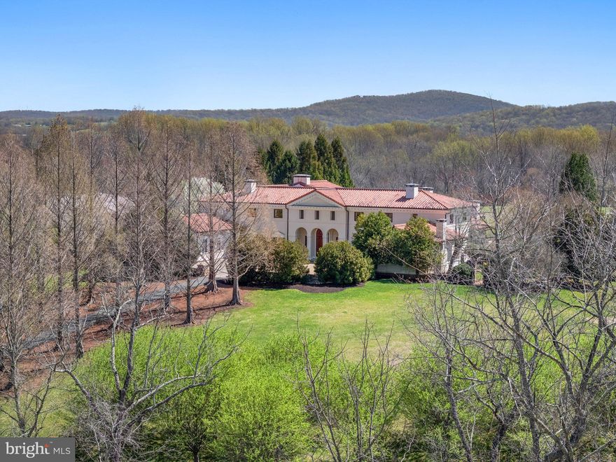 FIDELIO - 61 acres

An Exquisite Neoclassical Italian Estate in the heart of Virginia Hunt Country between Middleburg and The Plains. This one-of-a-kind property seamlessly blends Old World elegance with modern luxury, offering unparalleled craftsmanship and breathtaking natural beauty.  Exceptional materials rarely seen:  mahogany doors and windows, limestone floors, antique fireplaces imported from Europe, hand painted coffered ceilings and intricate detailing throughout.  Elevator accommodates choice of main level primary suite or the upper level option with private study and porches over looking the Bull Run Mountains.  Substantial renovations throughout.    

Enchanting grounds have been reimagined providing lush green space and mature plantings.  Notable stone walls surround the property and gardens.  Great privacy, a flowering orchard, stunning metasequoia lined driveway, stone bridges, creeks and desirable Little River frontage.  

Resort-style pool, guest house and spa/fitness room overlooking the sport court.  Additional living spaces include a 3 bedroom stone manager's house and stunning home office/art gallery perfect for private collection and/or stunning work space.  

This rare offering is a serene retreat and an entertainers dream in one of Virginia's most protected locations.