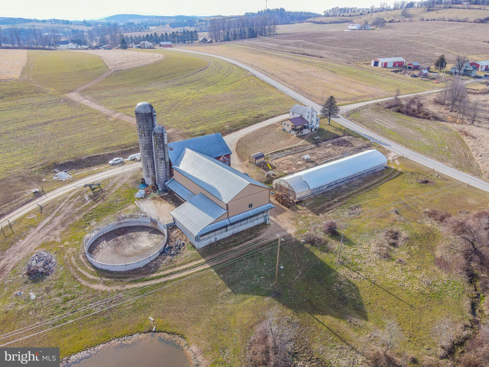 Located nicely in Glen Rock and within 5 miles of the Maryland line is a fully operational dairy farm. The property is currently not preserved allowing for potential subdivision or preservation value. The dairy operation was setup in 2017 and the farm boasts 47 tillable acres. The dairy operation features a new 40x86sqft dairy barn, an existing 40x60 bank barn with a 40x126 cow stable extending underneath the bank barn, 2 new silos (16x70 and 10x55,) a newly installed 10x56 concrete manure pit, a 32x140 greenhouse which is currently used for hanging tobacco. This sale also includes a diesel generator, a milk tank, a 25HP hydraulic ceiling fan system, propane tank and the woodstove in the house. Truly a unique opportunity in this market to be able to purchase, move in, and immediately begin operating a dairy business!