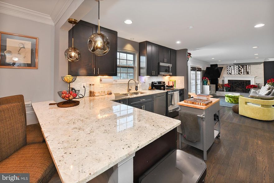 Welcome to a home that not only offers comfort and style but also thoughtfully designed spaces for every aspect of your life.  Located in an established neighborhood, this beautifully designed residence is more than just a place to live—it's a space where cherished memories are made and peaceful moments are a daily delight.

The open-concept living and dining area greets you upon entry, showcasing a modern design that's perfect for both relaxation and hosting gatherings. Flooded with natural sunlight, the warm ambiance of this space is immediately welcoming. The kitchen, a standout feature, boasts stainless steel appliances, sophisticated dark wood cabinets, and abundant space for culinary exploration. Next to the kitchen lies a spacious family room, which opens onto a large deck through elegant double doors. The deck leads to an expansive, fenced backyard, offering a private and versatile outdoor space for both entertainment and quiet enjoyment.

As you explore further, the second level presents four well-positioned bedrooms, including an owner's suite with a sizeable walk-in closet and an ensuite bathroom, offering a private retreat within your home.

The fully finished basement opens up a world of possibilities for entertainment and personalization. Envision creating your own home theater, or utilize the extra room as an office, additional sleeping area, or whatever your imagination conjures. This level also includes a modern, like-new washer and dryer in the utility room, adding to the home's conveniences.

Additionally, the basement provides egress to the expansive backyard, extending your living space outdoors. Here, the vast, fenced yard is perfect for outdoor activities and gatherings, enhancing the joy of home ownership.

With a double car garage and additional driveway parking, practicality is at the forefront of this home's design. The local area further enriches your experience, with playgrounds within walking distance and a variety of shopping and dining options just moments away.

This property uniquely combines comfort, style, functionality, and a sense of community. It's a rare find in today's market. Don’t miss your chance to make this exceptional home yours.