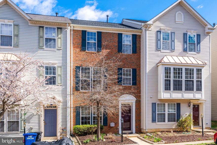 Take a close look at this beautiful brick townhouse—it's in excellent condition!
What makes this home stand out is the spacious layout across three levels and the warmth of real wood floors. Large, well-placed windows fill the home with natural light. The eat-in kitchen flows seamlessly into a sunroom, perfect as a family room or additional living space. The entry-level features a fourth bedroom with a full bath, along with a rec room that opens to a private patio enclosed by a tall fence.  From the kitchen, step onto the wrap-around composite deck, offering a great space for outdoor entertaining.
Upstairs, the primary bedroom comes with vaulted ceilings and a spacious en-suite bathroom with dual sinks, a separate tub, and a shower.
Situated in the heart of the Dulles Technology Corridor—home to industry leaders like AWS, Microsoft, Google, Raytheon, Accenture, Adobe, and Cisco—this location is a smart investment in your future.
