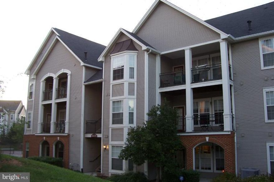 Ground level 2 Br 2 Ba w pool & tennis views * Newer carpet  * Recently painted * Entry foyer w ceramic tile * Laundry room w cabinets * Master suite w Ba * Secondary Br w Ba * Living room w crown moulding, built-ins & gas fpl * Dining room w access to balcony w storage * Bay window kitchen w pantry, gas cooking & microwave * Community pool, tennis and tot lot *