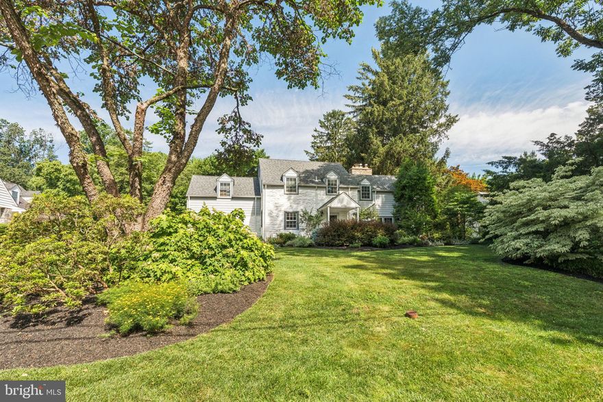 Tucked away on one of Penn Valley’s most peaceful and desirable streets, this meticulously maintained and thoughtfully updated stone colonial offers the perfect blend of classic charm and modern comfort. Set on a beautifully professionally landscaped, level fenced lot surrounded by mature trees, this home is a private retreat ideal for both everyday living and elegant entertaining. Step into the inviting foyer, where a powder room and coat closet offer convenience upon entry. The spacious, sunlit eat-in kitchen has off white cabinets space, SubZero Refrigerator(2023), induction cooktop(2024), newer dishwasher(2022), wall oven, built-in microwave, tile backsplash and hardwood floors that flows seamlessly into the expansive family and dining rooms with a wood burning fireplace, hardwood floors, recessed lights plus 2 outside entrances. Large windows in the kitchen and family room/dining area flood the interior with natural light and provide serene views of the in-ground pool, stone patio and a covered outdoor entertaining space perfect for summer gatherings or quiet relaxation.The main level also features a charming spacious library/den with custom built-in shelving, a dedicated office space, and a mudroom with abundant storage all leading to the attached 1 1/2 car garage. Upstairs, the generously sized primary suite is a true sanctuary, complete with vaulted ceilings, ceiling fan, hardwood floors, a large dressing room with custom closets, and a beautifully updated en-suite bath featuring a walk-in steam shower, dual-sink vanity, and cabinetry. Four additional bedrooms, two full baths, plus a conveniently located laundry room complete the second floor. The finished lower level offers exceptional flexibility with a large multi-use room perfect for a family room, playroom or office with a gas fireplace plus a separate room ideal for a home gym or creative studio. A utility room with ample storage space and closets round out the lower level. Notable updates include: Roof(2021), Windows( 1st floor 2017 and 2nd floor(2022-Marvin Windows), Hot Water Heater(2025),Exterior Painted(2024) including window frames that were replaced or repaired This home has recessed lighting and hardwood floors throughout. This home combines character, comfort, and functionality in a coveted Lower Merion location, just minutes to Narberth, award-winning Lower Merion Schools, local shops, restaurants plus easy access to Center City Philadelphia. Don’t miss the opportunity to make this exceptional home your own.