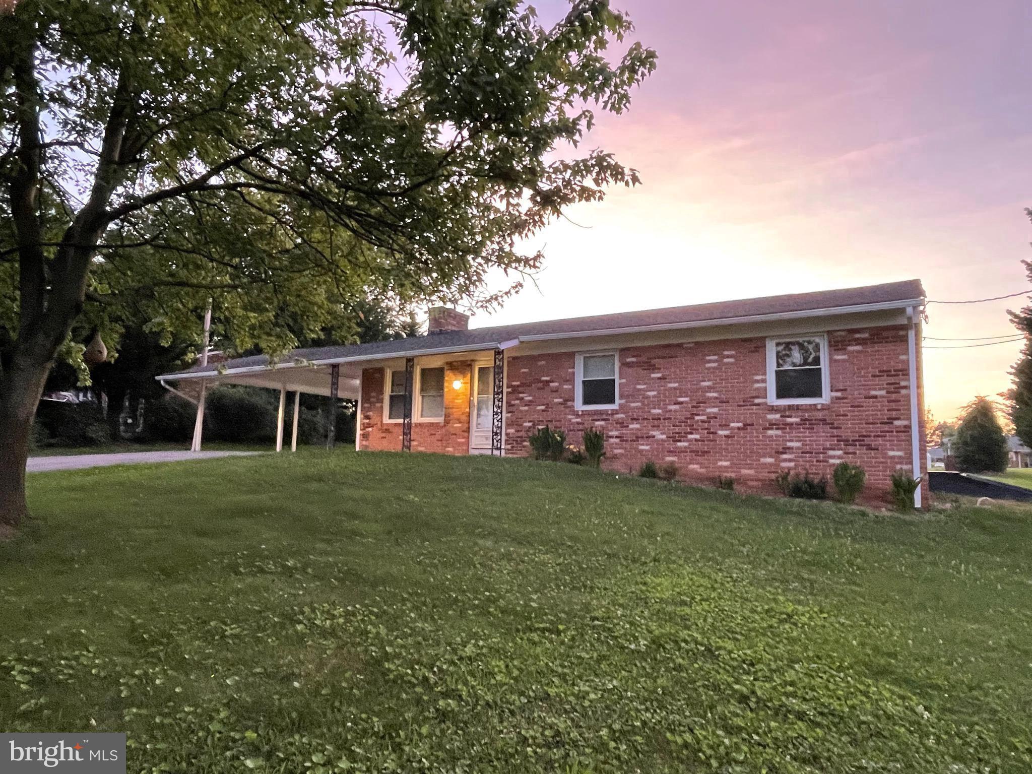 Price reduced 10K! NO HOA! Don't miss out on this cozy 3-bedroom, 2-bath brick rancher located in the desirable Falling Waters area of West Virginia! Built in 1972, this classic home offers timeless appeal. Enjoy spacious addition for a great room with kitchen living and dining combo. Extra living room or formal room, comfortable bedrooms with ample closet space, also basement featuring bonus rooms perfect for a home office, gym, or guest space. Outside, you'll love the large 2-car carport and generous level lot with a rear alley to access the property too. A great yard to add that huge pole building or swimming pool. The deck is off the great room — ideal for outdoor gatherings or relaxing in your own backyard. This home is conveniently situated near the Maryland line, this home offers an easy commute and quick access to I-81 & I-70, shopping, dining, and schools. Whether you're a first-time buyer or looking to downsize, this solid brick rancher combines value, location, and charm. Don’t miss this great opportunity!