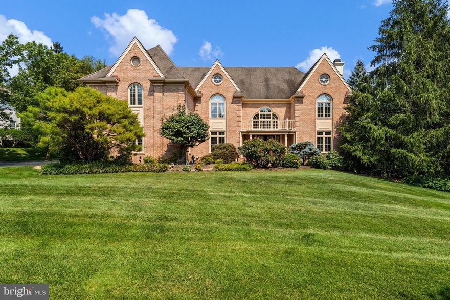 This stately, brick 5 BD, 4/3 BA manor home is nestled on Van Lears Run in Villanova, a quiet cul-de-sac street in a prestigious Radnor Township neighborhood. Located near the Ardrossan Estate, this property is convenient to the Blue Route, Center City, and Airport. The level, nearly 1 acre yard features flowering shrubs, mature specimen plantings, and sweeping expanses of manicured lawn for recreation. The light-filled, 2-story Entrance Hall features large arched windows, a curved staircase, and marble flooring. Entertain guests in the gracious Living Room with fireplace, followed by meals in the large formal Dining Room, which has an adjoining Wet Bar, complete with a wine frig & glass-front cabinets. Work from home in the private, 1st floor Office/Library, which also has built-in shelving. The soaring Family Room is perfect for relaxing and features a cathedral ceiling with skylights, exposed beams, and a 2nd fireplace. You’ll never run out of storage or counter space in the large Kitchen, which features cherry cabinets, gas cooktop, double wall ovens, microwave, and a large stainless refrigerator. The vaulted Breakfast Room and barstool seating at the island offer ample space for casual everyday dining, and a built-in desk is ideal for menu planning or homework. The Mudroom and Laundry Room are located near the oversized 3-car Garage. Formal and casual Powder Rooms and more closets complete the 1st floor. Upstairs, a curved 2nd floor balcony with pillars overlooks the Family Room. The Master BD suite has a large sitting room, tray ceiling, 2 walk-in closets, luxurious Master BA with large tub & separate shower, and a private staircase to the 1st floor. Bedroom 2 has an en suite full BA. Bedrooms 3 and 4 share a large Jack-n-Jill BA. The 5th Bedroom and 4th full BA are in the walk-out, daylight Lower Level. This area would make an ideal in-law suite, since it also features a large Recreation/Family Room with fireplace, another Wet Bar, closets, and a 3rd Powder Room. Unfinished utility/storage room has ample room for gym/workout gear.  Attic offers additional storage space. Gleaming wood floors and enhanced millwork. All three zones of HVAC replaced in 2013. Large windows on all 3 levels and the expansive rear deck offer great views of the serene, well-landscaped grounds. Top-ranked Radnor schools and convenient access to many private schools make this an ideal location. Just minutes from train stations, shopping, parks, live music venues, and restaurants in the charming village of Wayne.